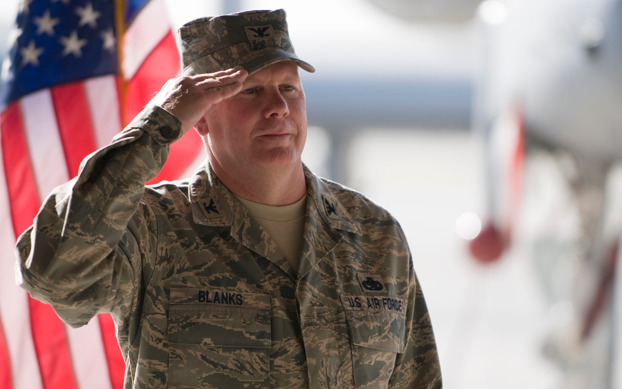 BAGRAM AIR FIELD, Afghanistan – Col. Cliffton Blanks, 455th Expeditionary Maintenance Group commander, returns a salute here on July 17, 2008. This customary first salute welcomes the new commander to his position and recognizes his authority as commander. (U.S. Air Force photo by Staff Sgt. Samuel Morse) 