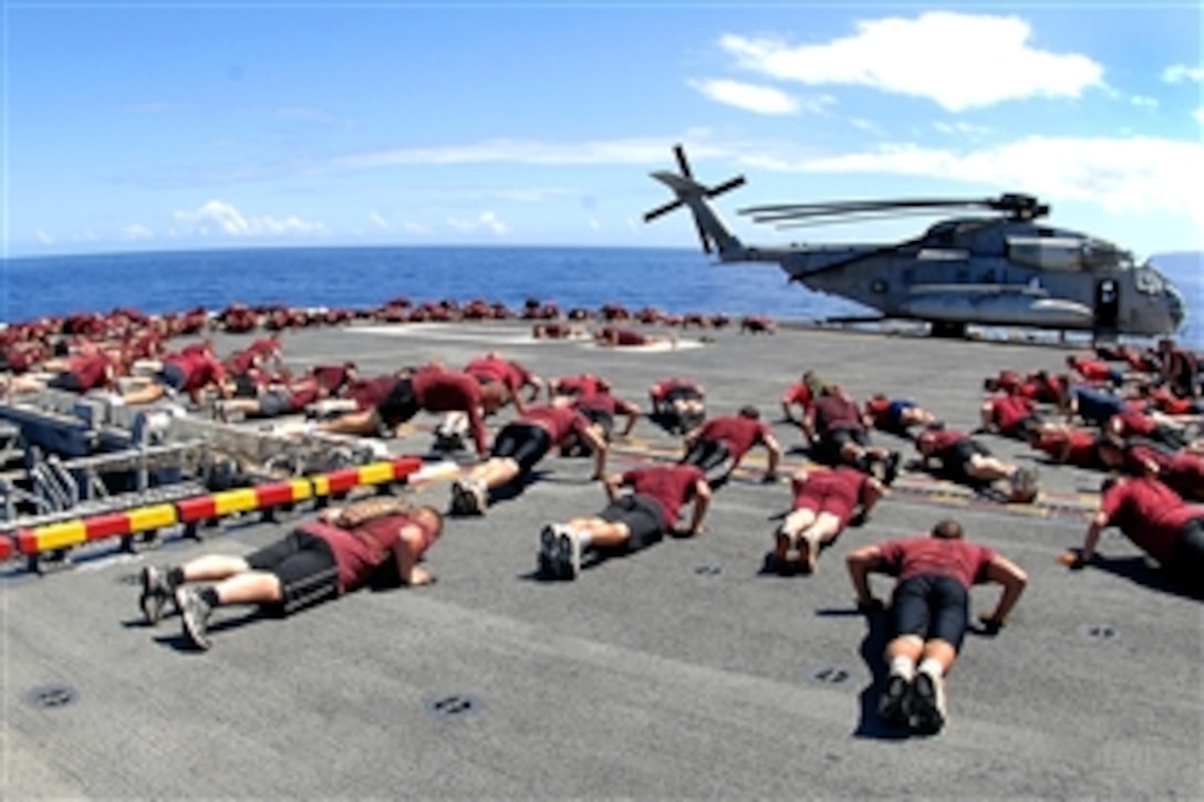 Canadian soldiers conduct physical training on the flight deck of the amphibious assault ship USS Bonhomme Richard during Rim of the Pacific, RIMPAC, 2008, Kauai, Hawaii, July 13, 2008. RIMPAC is the world's largest multinational exercise and is scheduled biennially by the U.S. Pacific Fleet. 