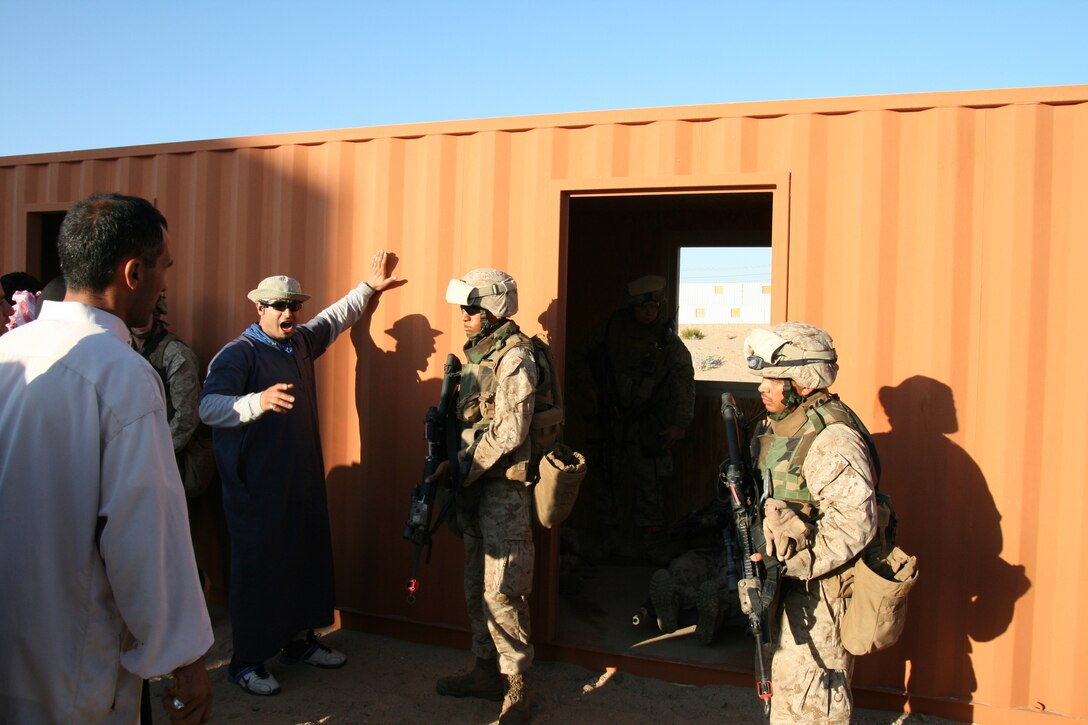 Marines from Company G, 2nd Battalion, 25th Marine Regiment, quell a notional riot during an urban training exercise in the town of "Wadi Al Sahara" at Marine Corps Air Ground Combat Center in Twentynine Palms, Calif., July 21, 2008.