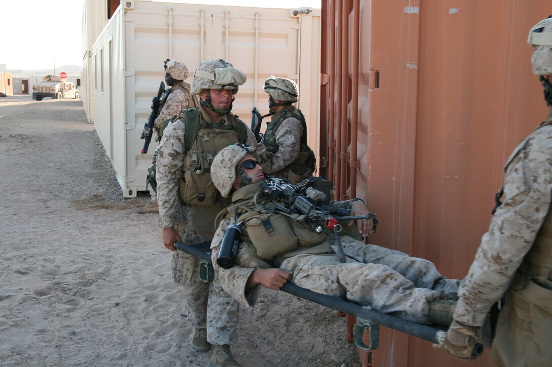 Marines from Company G, 2nd Battalion, 25th Marine Regiment, evacuate a simulated casualty to safety during a training exercise at Marine Corps Air Ground Combat Center in Twentynine Palms, Calif., July 21, 2008.