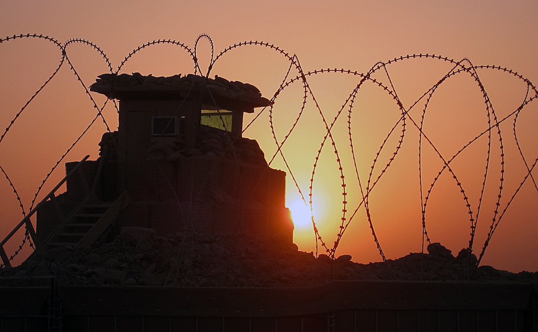 COMBAT OUTPOST GANNON II, Iraq (July 22, 2008) – Silhouetted against the sun was just one of a few watch towers built by combat engineers at the new Combat Outpost Gannon II July 22, which overlooks the border between Iraq and Syria. Engineers spent less than a month building the new outpost, which serves to constrict incoming insurgent personnel and materials, as well as help open the local Iraqi free trade market. (Photo by Capt. Lauren S. Edwards)