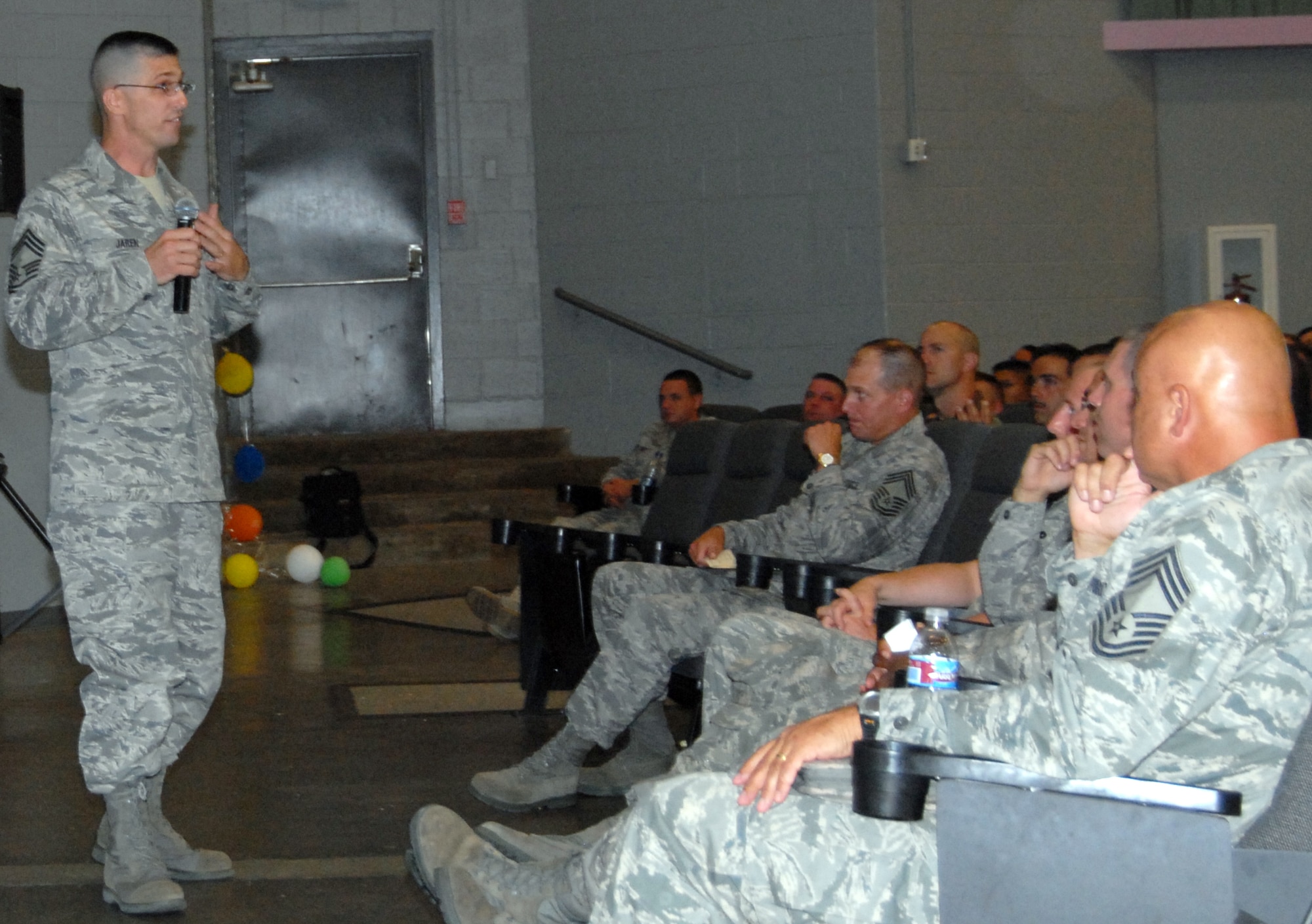 Chief Master Sgt. Eric Jaren, 95th Air Base Wing acting command chief, talks to Edwards Airmen during a basewide enlisted call at the base theater July 22. Some of the topics addressed were dormitory living conditions, the use of a $25,000 grant to improve quality of life, preventing situations that lead to driving under the influence and the importance of voting. (Air Force photo by Airman 1st Class William O'Brien)