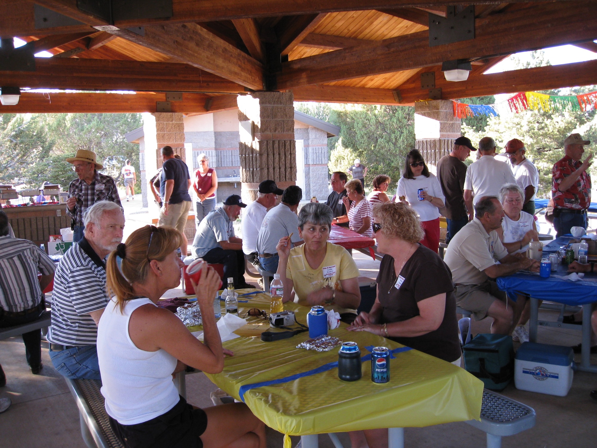 Retirees enjoy the weather, food and company at the annual picnic in the White Mountains.  The picnic is open to retired members from Phoenix and Tucson, as well as their family members.