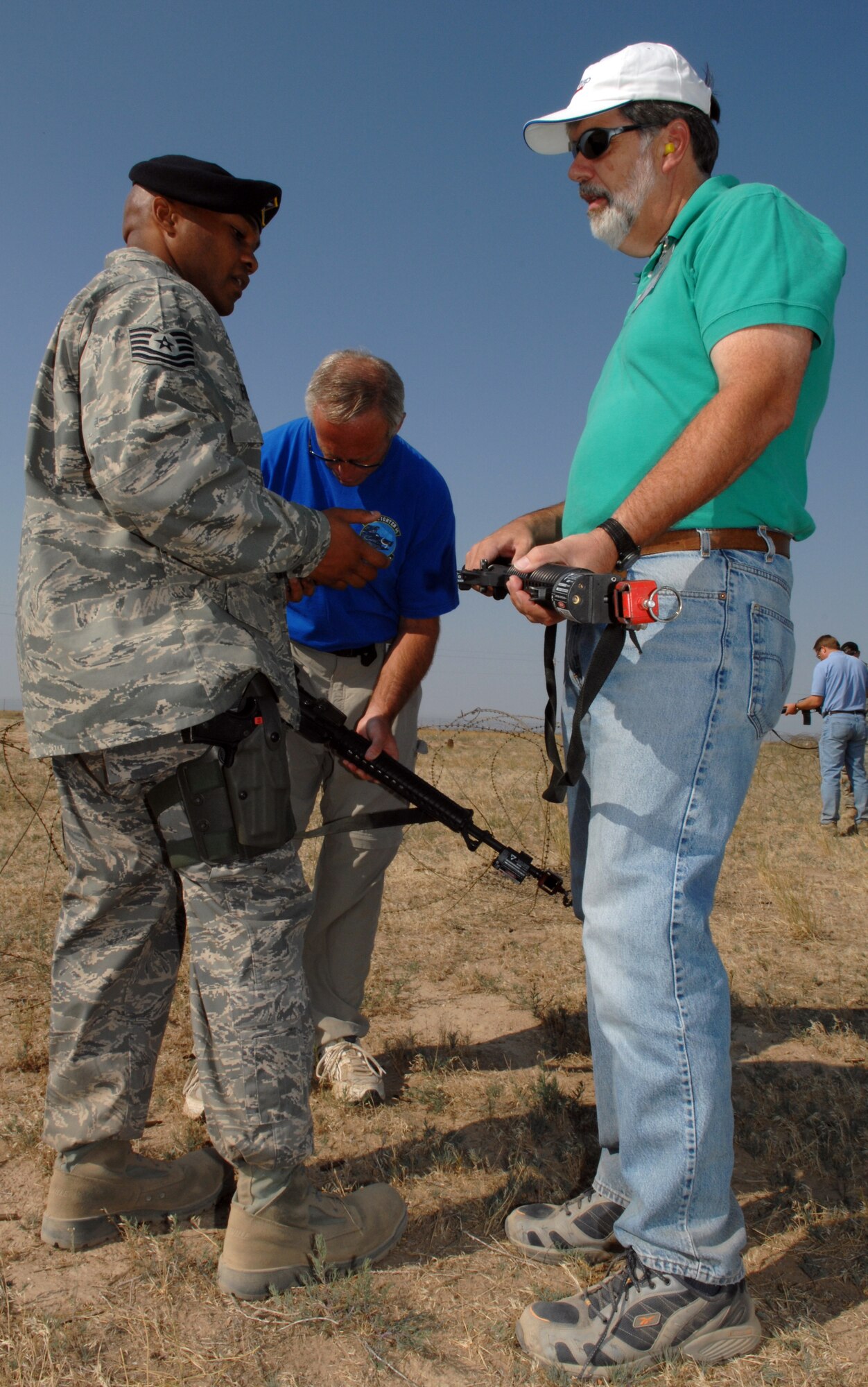 MOUNTAIN HOME AIR FORCE BASE, Idaho -- Tech. Sgt. Roberto Hernandez, 726th Air Control Squadron, briefs members of the Honorary Commanders program on the use of a field kitchen during the Air Expeditionary Day tour, July 16. Hosted by the 726th Air Control Squadron and the wing's public affairs staff, the half-day visit to the squadron's austere deployment training area offered honorary commanders a greater understanding of the missions Airmen are currently carrying out in Iraq, Afghanistan and numerous other deployed locations. Designed to increase the understanding of the 366th Fighter Wing and Air Force missions, the honorary commanders program annually pairs community, civic and business leaders with Gunfighter unit commanders and leadership. Throughout the year, honorary commanders participated in unique, creative events, hosted by each of the four groups, to learn about each aspect of the wing's missions. (U.S. Air Force photo/Airman 1st Class Ashley Winters)