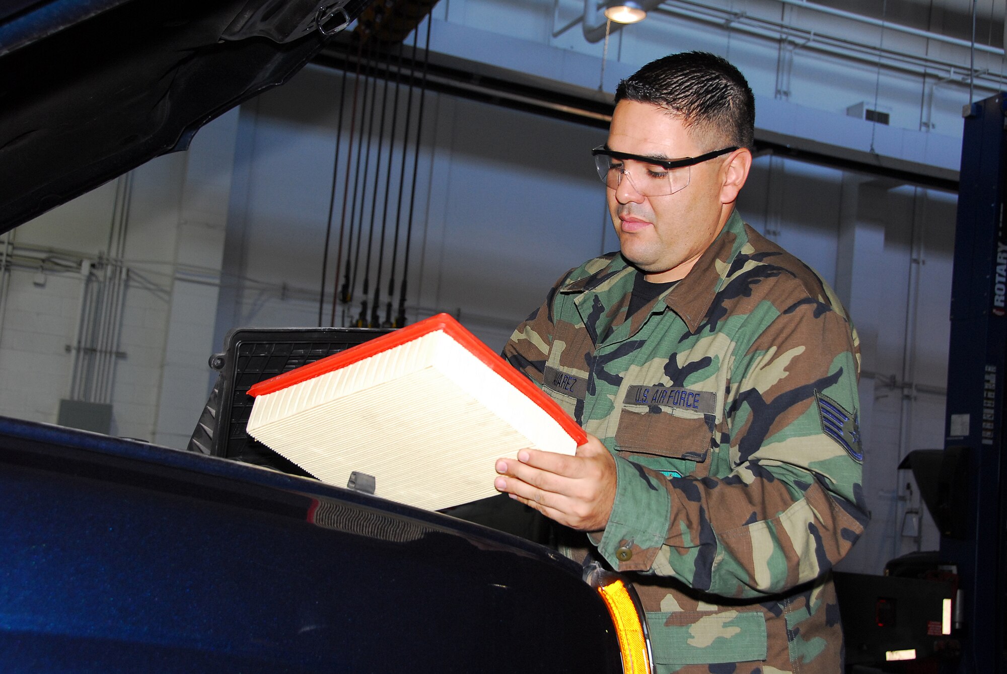 Vehicle Maintenance Mechanic, Staff Sgt. Mario Alvarez, inspects an air filter from a government truck to ensure the vehicle’s fuel efficiency. (Air National Guard photo by Master Sgt. David Neve)