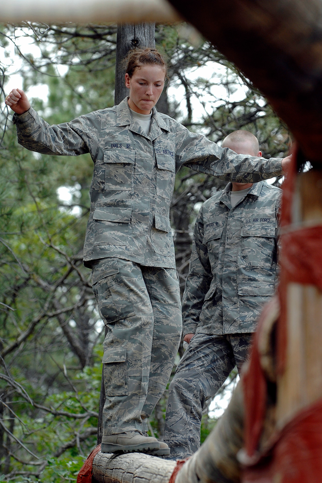 U.S. Air Force Academy Basic Cadet Katherine Dials traverses the confidence course July 15 at the Jacks Valley training area near Colorado Springs, Colo., during the field training portion of basic training.  (U.S. Air Force photo/Dave Ahlschwede)