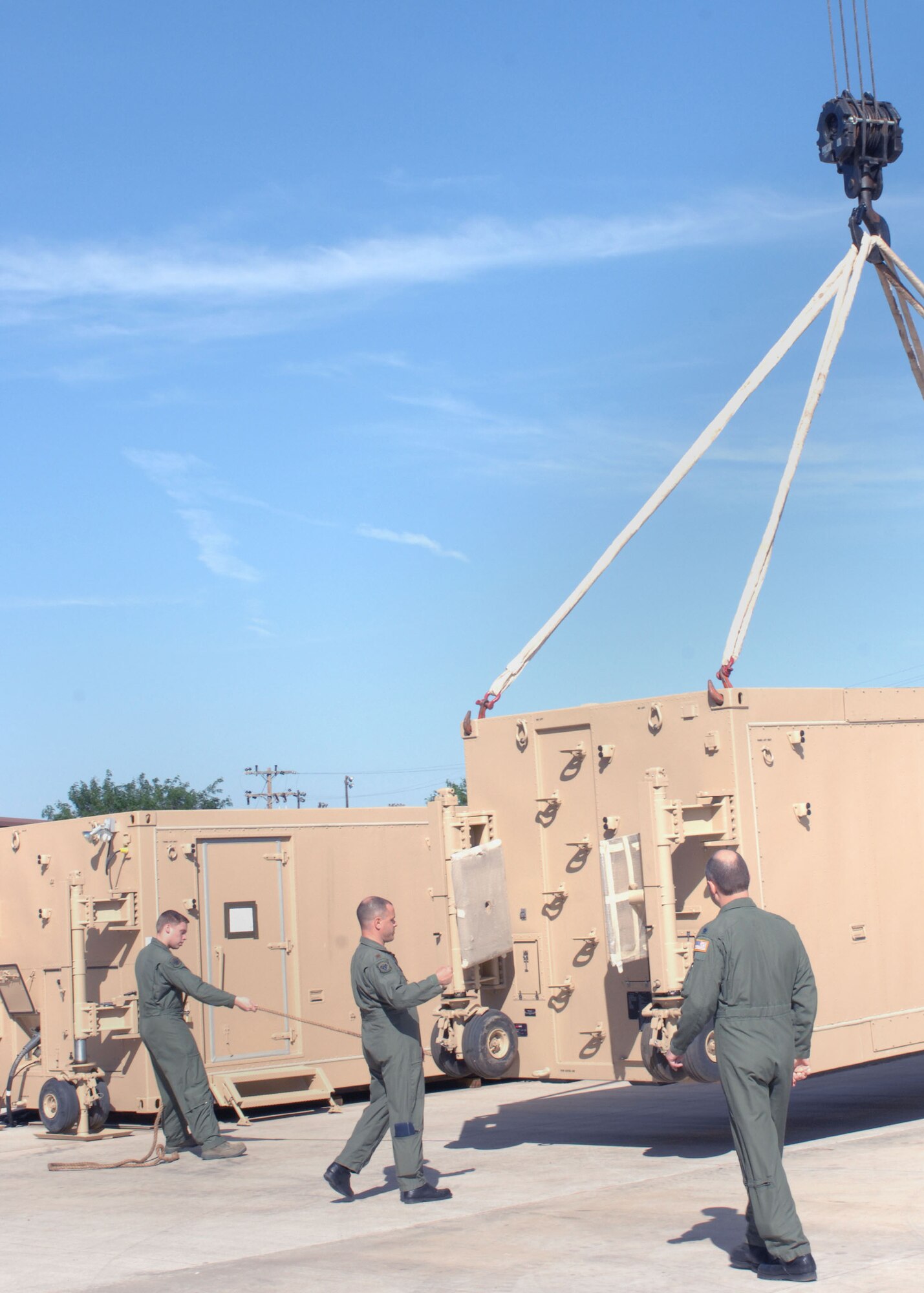 CANNON AIR FORCE BASE, N.M.--Airmen from the 3rd Special Operations Squadron place the new Ground Control Station next to their building on July 21. The GCS will be used by the 3rd SOS. (U.S. Air Force photo by Airman 1st Class James R. Bell)