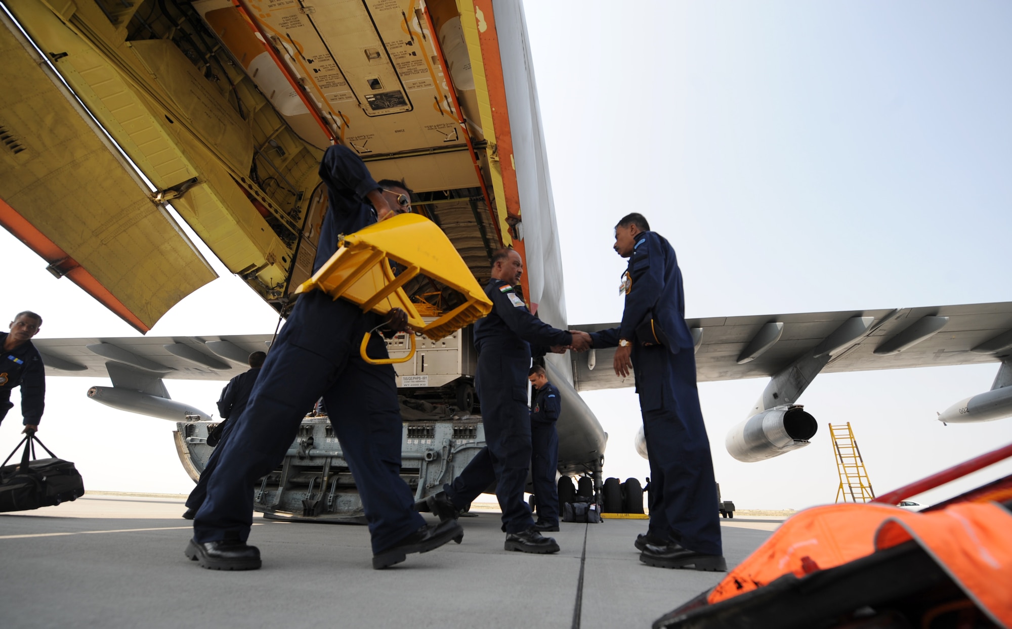 MOUNTAIN HOME AIR FORCE BASE, Idaho -- Aircrew members unload cargo from an Indian air force IL-76 Medium cargo aircraft after landing here July 17 to train with Mountain Home Air Force Base Airmen before participating in Exercise Red Flag at Nellis AFB, Nev., which begins Aug. 9. This is the first time in history the Indian air force has been on American soil to train with U.S. fighters. They will be taking advantage of Mountain Home's vast air space and multiple ranges to better prepare their aircrews for future flying missions. (U.S. Air Force photo/ Airman 1st Class Ryan Crane)