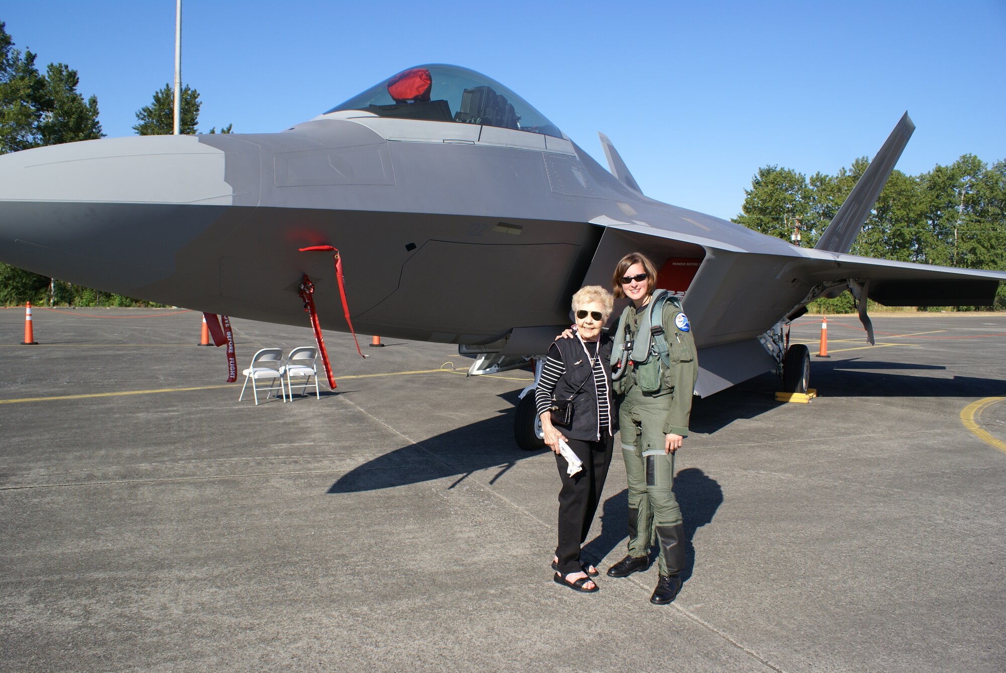 Dorothy Olsen, a former Women Airforce Service Pilot, meets with Capt. Jammie Jamieson, the first operational and combat-ready female pilot of the F-22 Raptor, here Sunday at the McChord Air Expo 2008. Captain Jamieson, currently stationed at Elmendorf Air Force Base, Alaska, is the mobility flight commander for the 525th Fighter Squadron. (U.S. Air Force photo/Staff Sgt. Eric Burks)