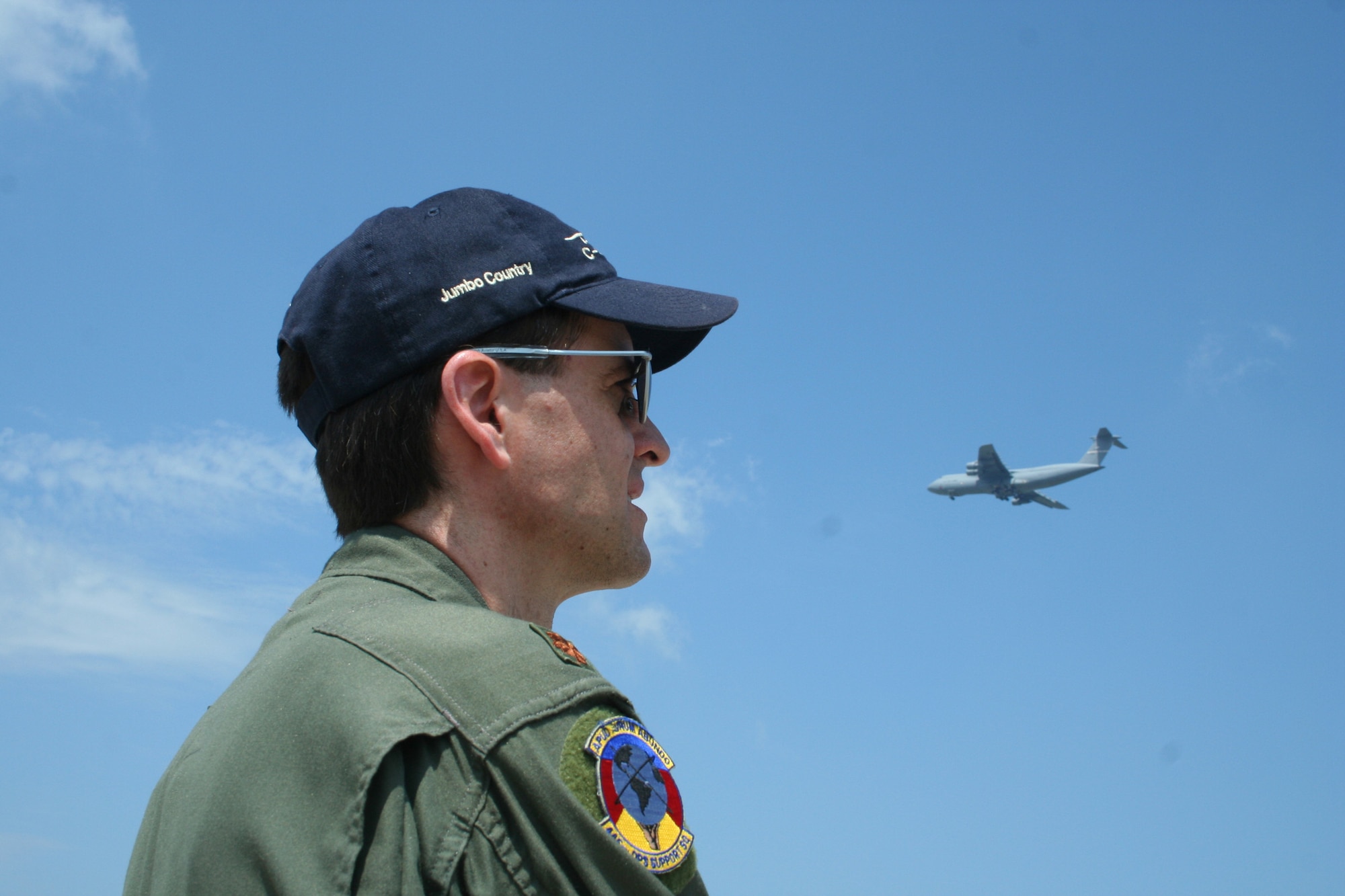 WRIGHT-PATTERSON AFB, Ohio - Maj. Mike Baker, 445th Operations Support Squadron, is the aerial display coordinator for the C-5 flyover.  He is directing the aircrew during flyover at the Dayton Airshow Sunday, July 20, 2008.  In addition to the flyover, the 445th Airlift Wing's massive C-5 static display was the center of attention at the Airshow. The C-5 is the largest aircraft in the Air Force inventory and is always a crowd pleaser as people can enter at the nose and walk through the aircraft and exit at the tail.  (U.S. Air Force photo/Senior Airman Ken LaRock)