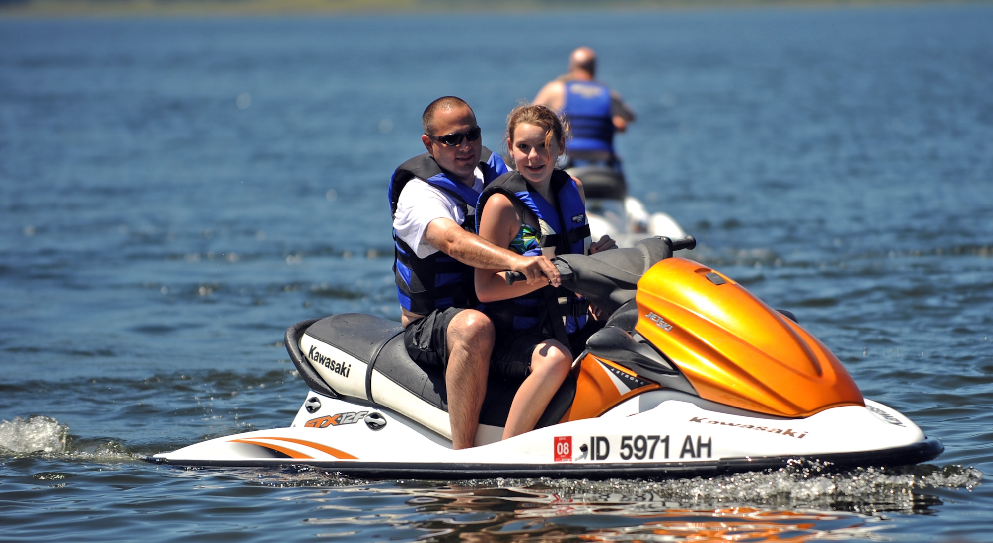 MOUNTAIN HOME AIR FORCE BASE, Idaho -- Families from Mountain Home Air Force Base take advantage of jet skis and other water activities offered at the private beach party hosted by Cascade community members on Lake Cascade during the Mountain Home Air Force Base marriage retreat July 12. While the chapel hosted the retreat, the entire Integrated Delivery System -- comprised of base agencies committed to helping active duty military members and their families, retirees and department of defense civilians -- provided support. These agencies include, but aren’t limited to, the Airmen and Family Readiness Center, family advocacy, health and wellness center and the chapel. (U.S. Air Force photo/ Airman 1st Class Ryan Crane)