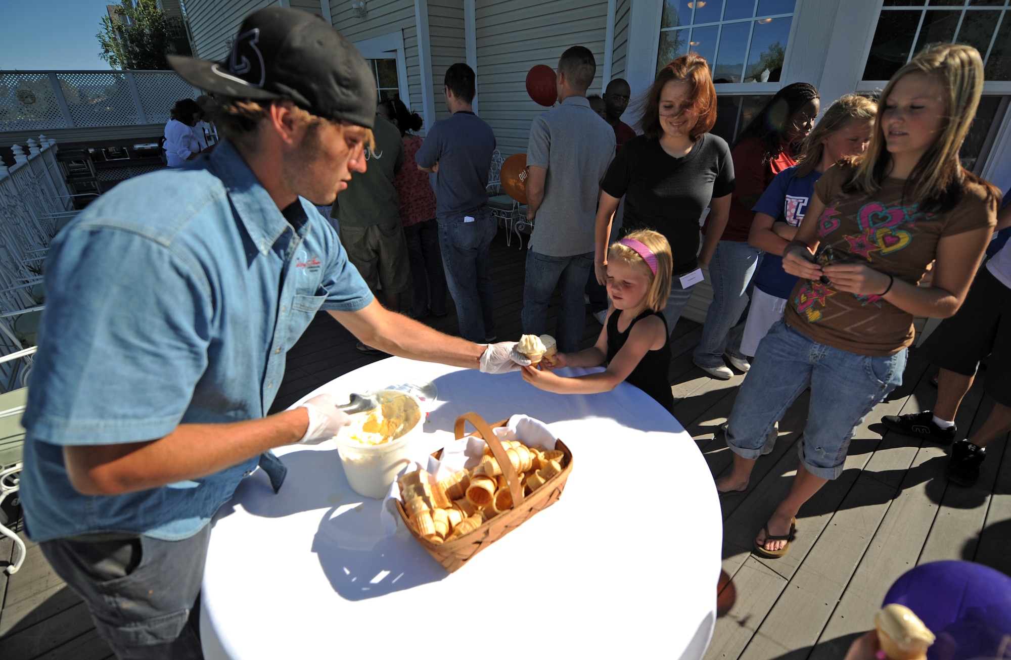 MOUNTAIN HOME AIR FORCE BASE, Idaho -- Hannah Miller accepts an ice cream cone from one of the staff members at the Ashley Inn, in Cascade, Idaho, during the Mountain Home Air Force Base marriage retreat July 11. While the chapel hosted the retreat, the entire Integrated Delivery System -- comprised of base agencies committed to helping active duty military members and their families, retirees and department of defense civilians -- provided support. These agencies include, but aren’t limited to, the Airmen and Family Readiness Center, family advocacy, health and wellness center and the chapel.  (U.S. Air Force photo/ Airman 1st Class Ryan Crane)