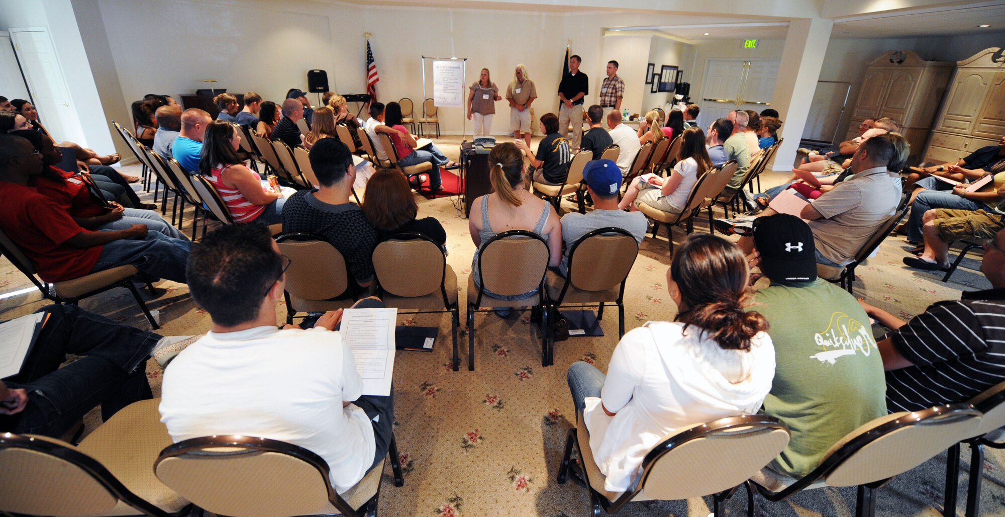 MOUNTAIN HOME AIR FORCE BASE, Idaho -- Laura Clagg, Master Sgt. Steven Wright, Gary Strickland and Capt. Samuel Tobler, class instructors, perform a skit to show couples how to handle communication issues during the Mountain Home Air Force Base marriage retreat July 11 through 13. While the chapel hosted the retreat, the entire Integrated Delivery System -- comprised of base agencies committed to helping active duty military members and their families, retirees and department of defense civilians -- provided support. These agencies include, but aren’t limited to, the Airmen and Family Readiness Center, family advocacy, health and wellness center and the chapel.  (U.S. Air Force photo/ Airman 1st Class Ryan Crane)