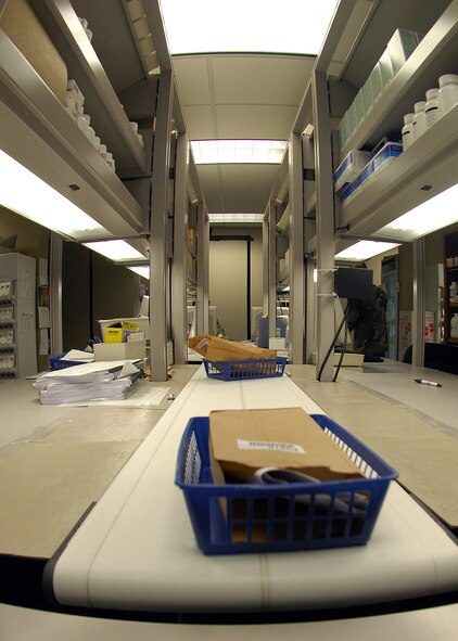 BARKSDALE AFB, LA --- A patient's prescription is ready to be picked up at the main pharmacy's temporary location on July 11, 2008. Once a prescription is filled and checked for accuracy by a pharmacist, it is put on the conveyor belt so it can be delivered to the patient. (USAF Photo by Staff Sgt. Trina R. Jeanjacques)