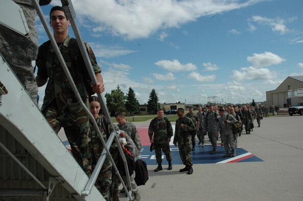 MINOT AIR FORCE BASE, N.D. -- Warbirds board an aircraft July19 departing for Red Flag at Nellis Air Force Base, Nev. Red Flag is a two-week, realistic combat training exercise involving the air forces of the United States and its allies with the purpose of improving combat capabilities and tactical training. Almost 150 Warbirds will participate in the exercise. (U.S. Air Force photo by Airman 1st Class Wesley Wright)