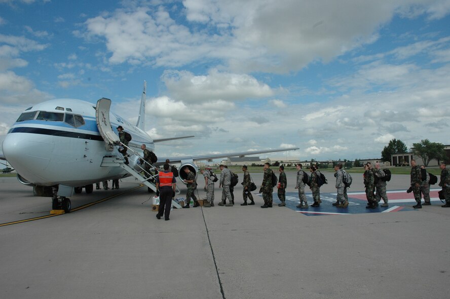 MINOT AIR FORCE BASE, N.D. – Warbirds board an aircraft July 19 departing for a Red Flag exercise at Nellis Air Force Base, Nev. Red Flag is a two-week, realistic combat training exercise involving the air forces of the United States and its allies with the purpose of improving combat capabilities and tactical training.