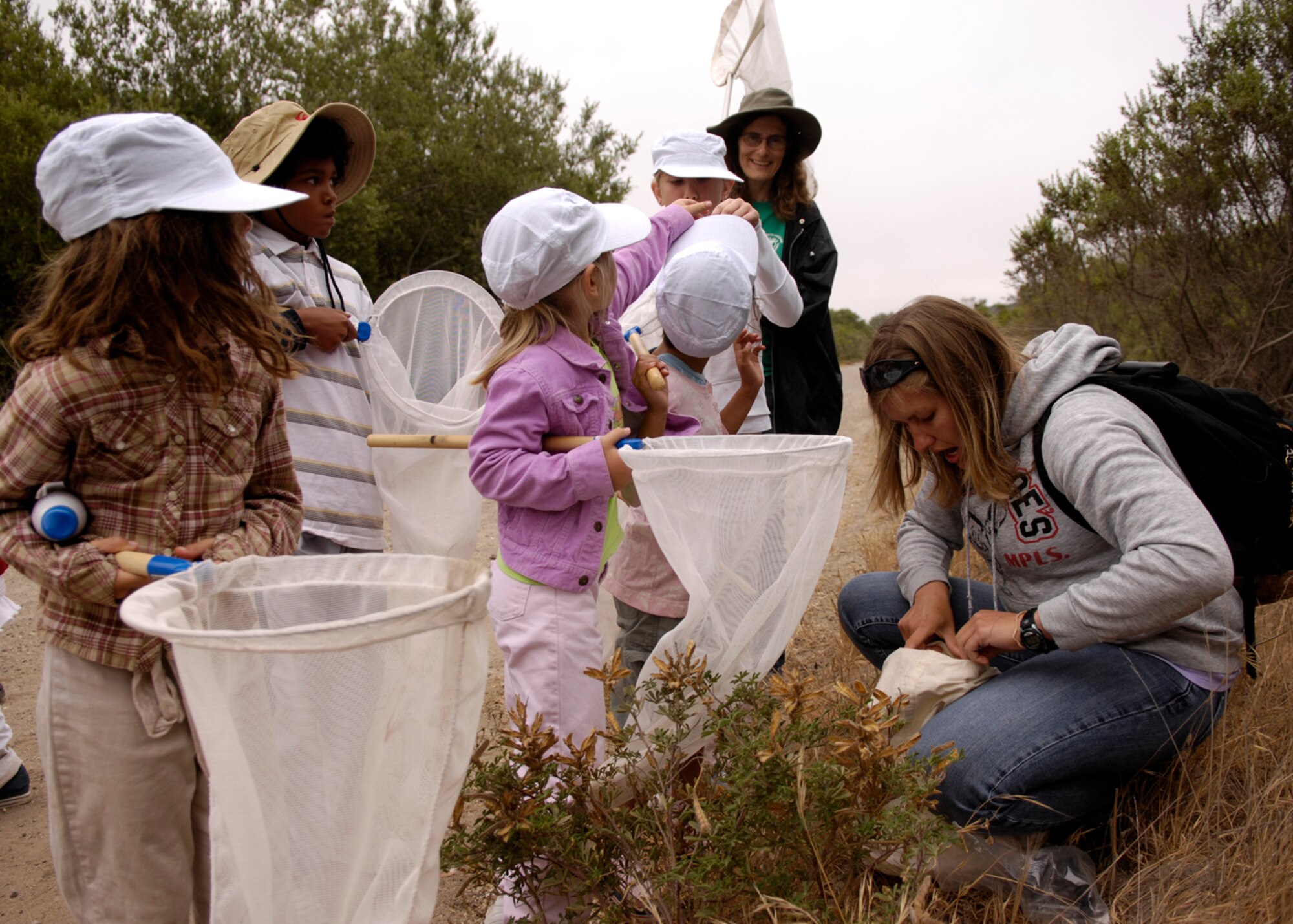 VANDENBERG AIR FORCE BASE, Calif. --  Children and teachers with the Vandenberg Youth Center, try to catch bugs during an educational trip to Pine Canyon Lake on Friday. (U.S. Air Force photo/Airman 1st Class Jonathan Olds) 