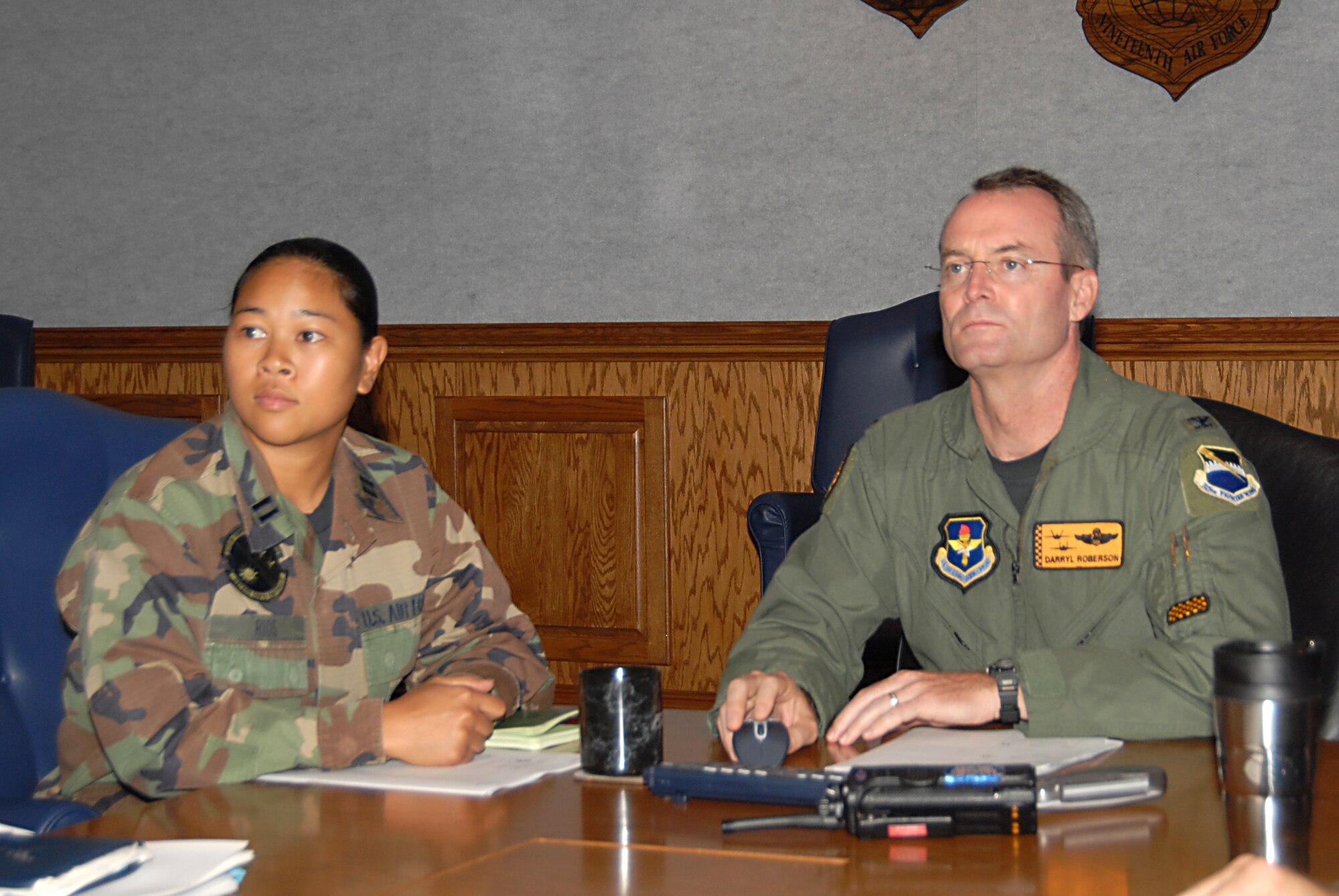 Capt. Margaret Rios, 325th Communications Squadron Operations flight commander, shadows Col. Darryl Roberson, 325th Fighter Wing commander, during the commander’s staff meeting here Tuesday. Captain Rios is responsible for coordinating the 1.3 million dollar Giant Voice tower project. She is also a Food Basket drive volunteer, contributing to the local homeless relief efforts. Captain Rios spent the day with Colonel Roberson as part of the Commander’s Shadow Program. She has served five years in the military and is a native of Guam. (U.S. Air Force photo by Susan Trahan) 