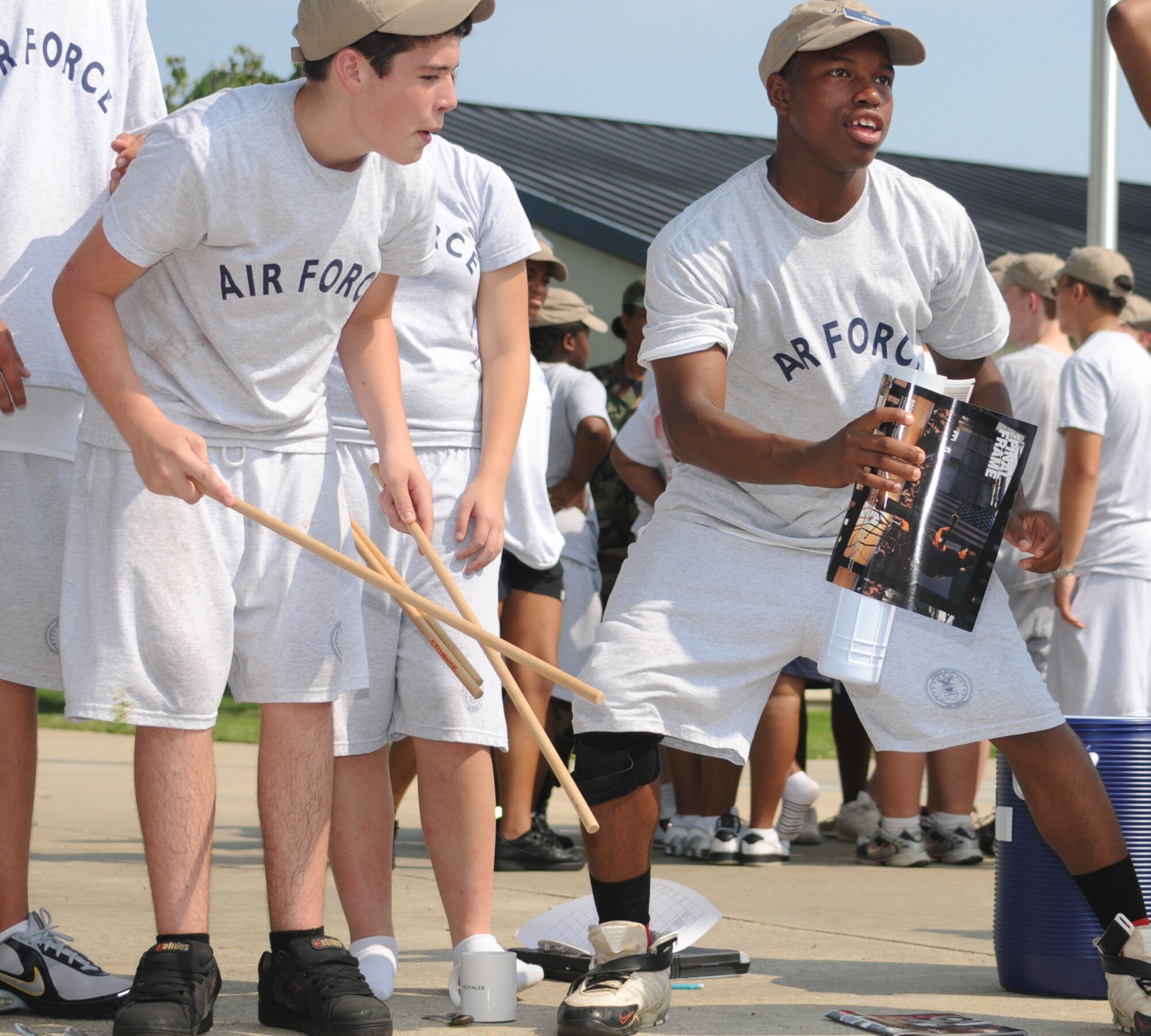 Cadet Staff Sgts. Westley Vidrine, left, and Martez Hooks of Lancer Flight work together  to overcome an obstacle during a team-building exercise July 17.  Cadet Vidrine, 16, is a sophomore at L.W. Higgins High School, La.  Cadet Hooks, 15, is a sophomore at South Panola High School, Miss.  (U.S. Air Force photo by Kemberly Groue)