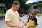 LA PAZ, Honduras ? Air Force Capt. Justin Rex, Joint Task Force-Bravo Plans and Exercise officer, helps a child from the San Antonio Orphanage pick out a sticker. More than 40 volunteers from JTF-Bravo, 1-228th Aviation Regiment and the Inter-American Air Force Academy NCO Course came to the orphanage to play games, have a cookout and spend time with children July 19.