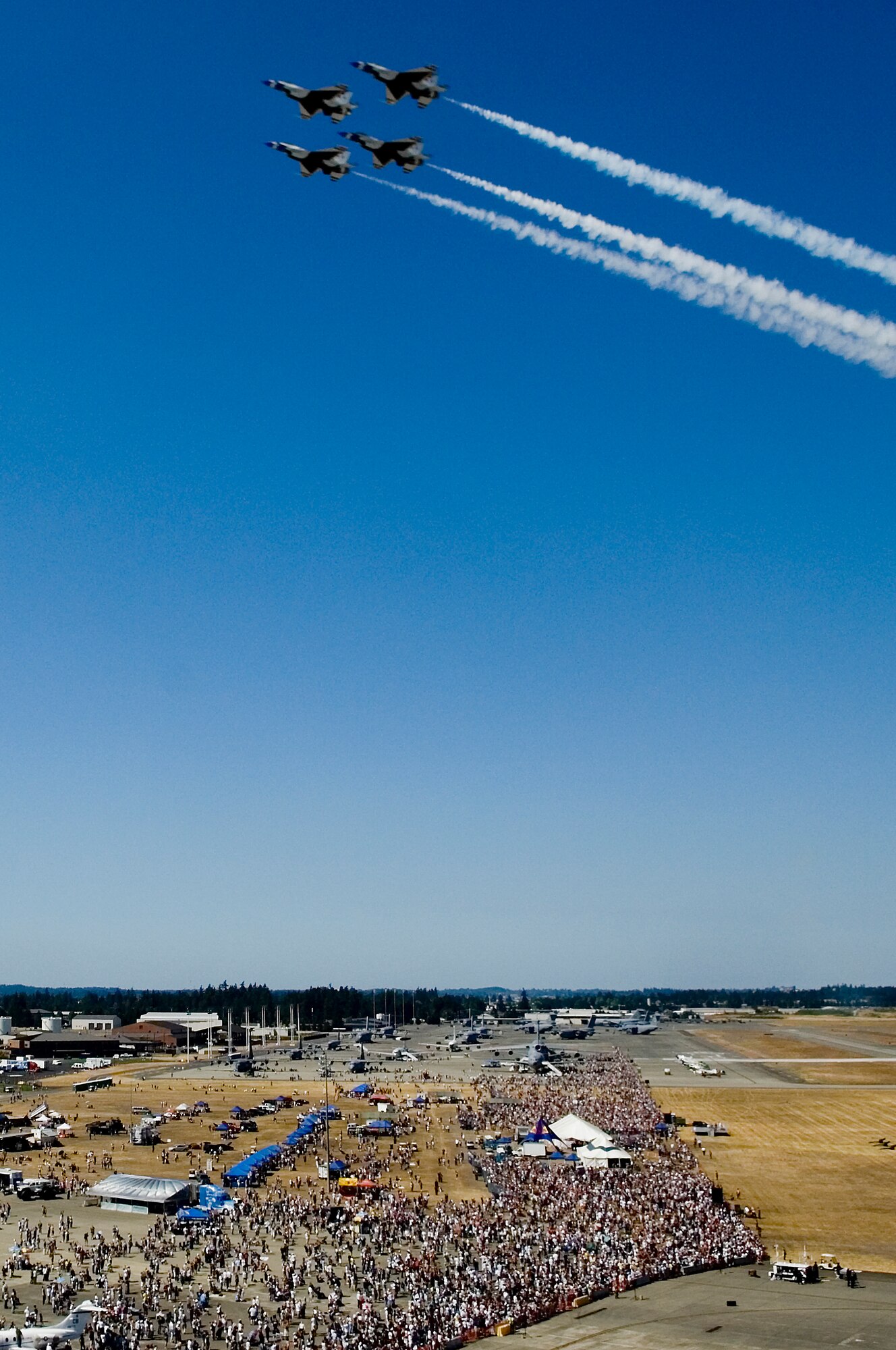 The United States Air Force Thunderbirds diamond formation soar over the record crowd at the McChord Air Expo 2008 here Sunday. (U.S. Air Force photo/Abner Guzman)