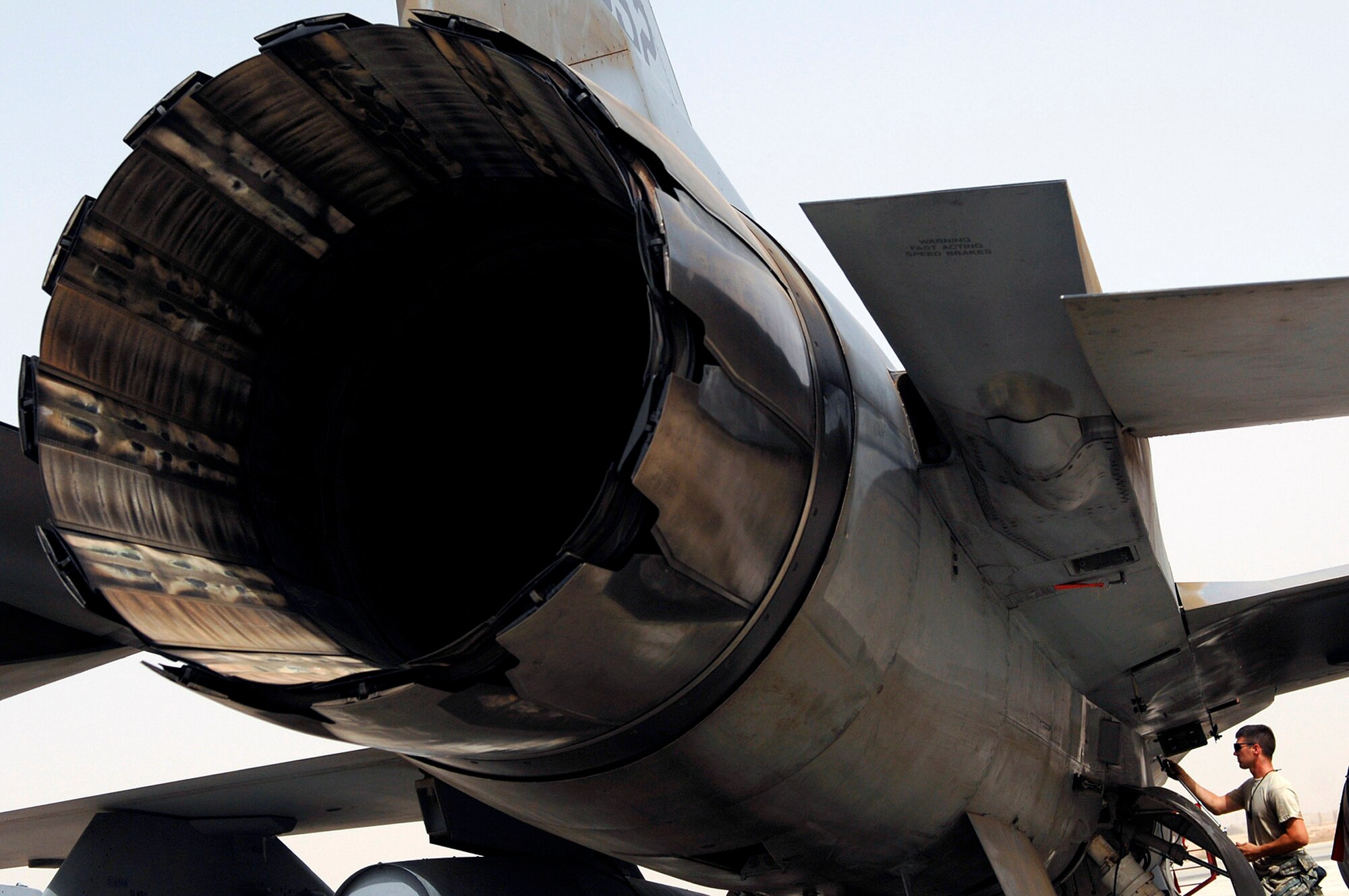 Senior Airman Sean Weygandt screws in a panel on an F-16 Fighting Falcon before running up the engine July 16 at Joint Base Balad, Iraq. The run up of the engine back and forth from full afterburner to idle allows the engine mechanics and crew chiefs to ensure all systems are fully functional before putting the fighter back into operational use. Airman Weygandt is a 77th Aircraft Maintenance Unit engine mechanic deployed from Shaw Air Force Base, S.C. (U.S. Air Force photo/Senior Airman Julianne Showalter) 
