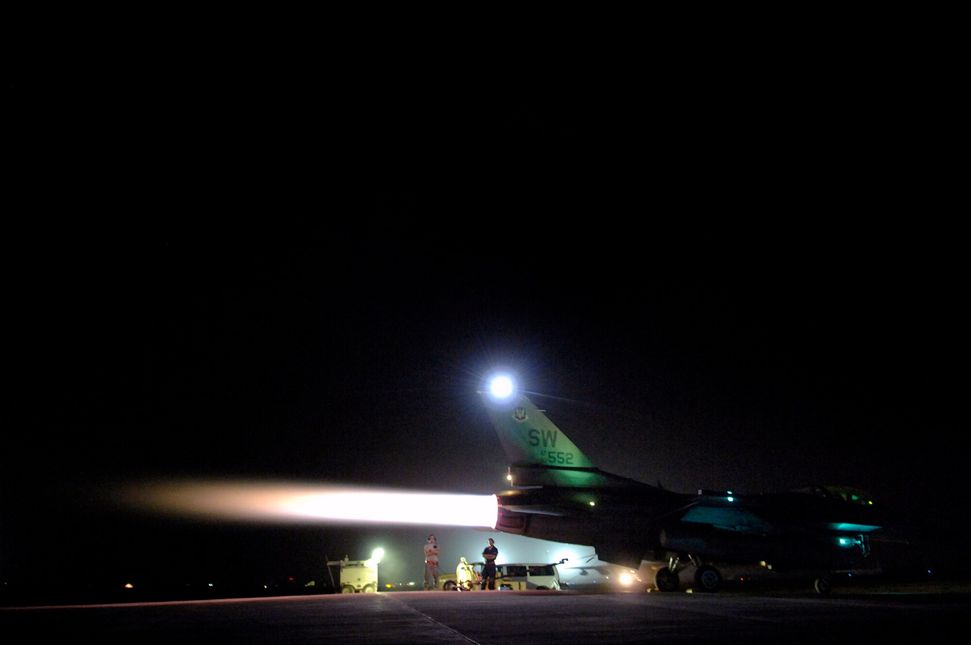 Senior Airman Graham Willis and Staff Sgt. Ferdinand Brown observe an engine run up of an F-16 Fighting Falcon July 16 at Joint Base Balad, Iraq. During the run up, the mechanics stay vigilant for faulty parts and, after the run up, will fix them on the spot. Going back and forth from full afterburner to idle puts stress and varying power levels through the jet and tests the computer in the cockpit with the jet's physical responses. Airman Willis and Sergeant Brown are 77th Aircraft Maintenance Unit engine mechanics deployed from Shaw Air Force Base, S.C. (U.S. Air Force photo/Senior Airman Julianne Showalter) 
