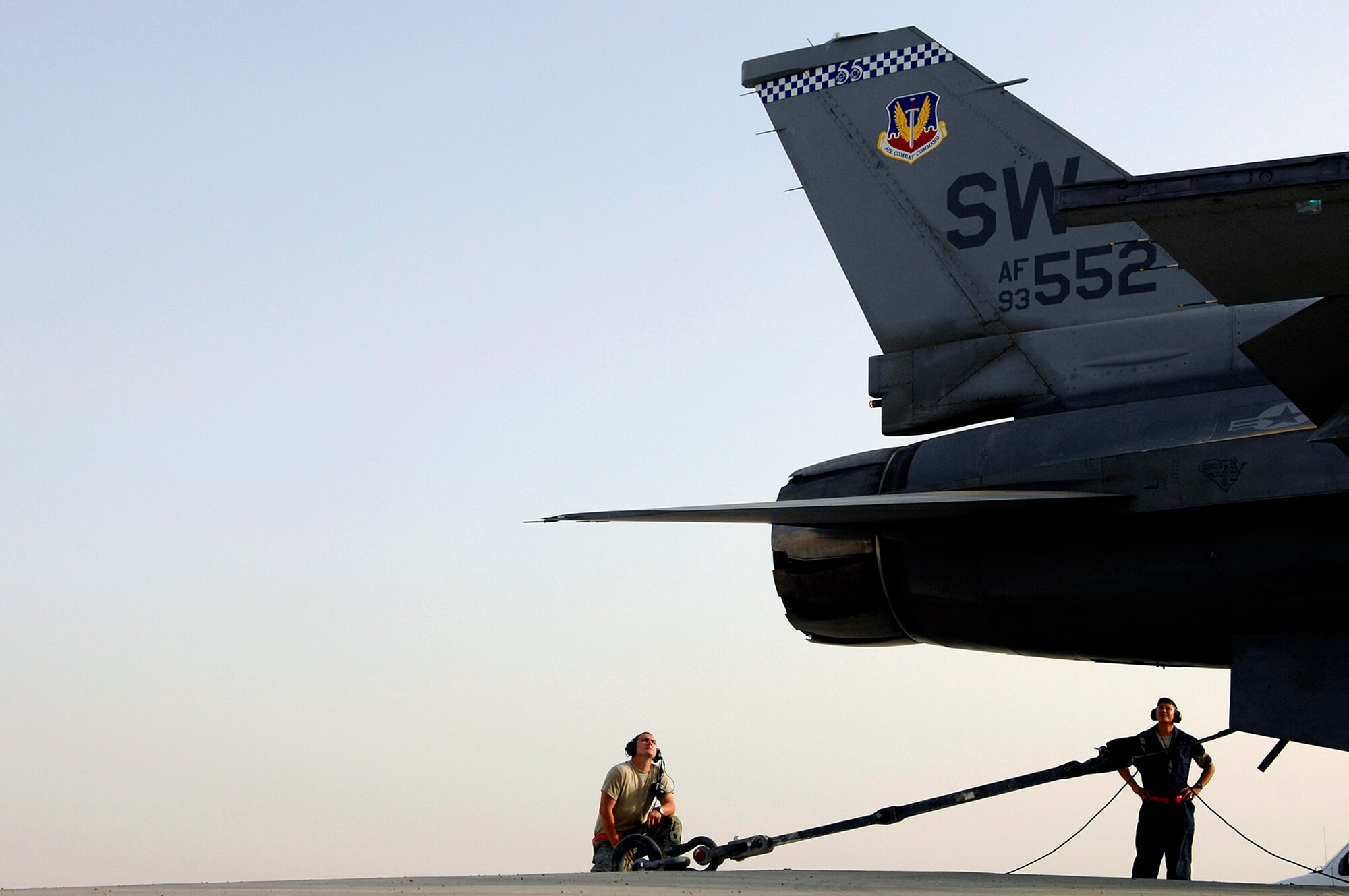 Senior Airman Graham Willis and Staff Sgt. Ferdinand Brown watch as an F-16 Fighting Falcon idles before going into full afterburner during an engine run up July 16 at Joint Base Balad, Iraq. The mechanics on the ground examine the engine during the run up checking for leaks, smoke or anything else that may fail while the mechanic in the cockpit goes through a checklist of gauges and components. Airman Willis and Sergeant Brown are 77th Aircraft Maintenance Unit engine mechanics deployed from Shaw Air Force Base, S.C. (U.S. Air Force photo/Senior Airman Julianne Showalter) 
