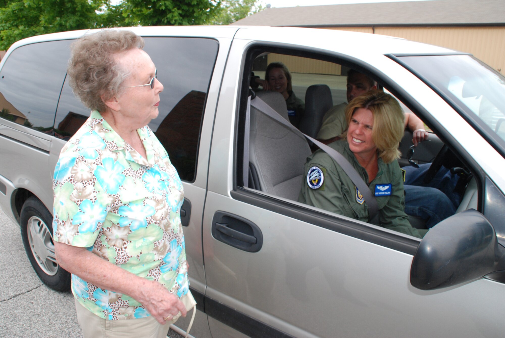 932nd Airlift Wing flight attendants explain their roles and responsibilities to Tech Sgt. Gerald Sonnenberg's mom during a visit as he reenlisted.  Photo/Maj. Stan Paregien
