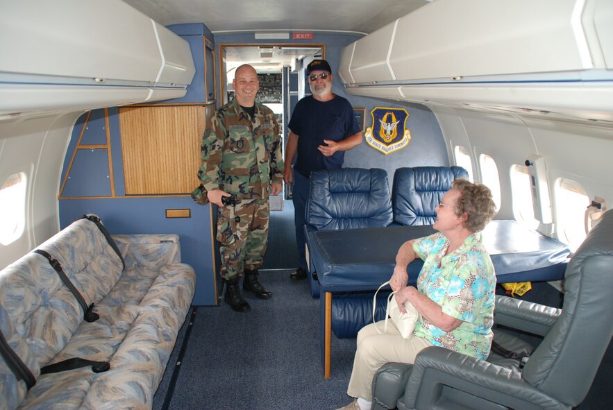 Inside the C-9C is 932nd Airlift Wing headquarters staff member, Tech Sgt. Gerald Sonnenberg, with his beaming parents a few moments after reenlisting for another six years with the Air Force Reserve Command unit.  They were impressed by the people they met during the ceremony and the mission they heard about.  The mission of the 932nd Airlift Wing, assigned as a tenant unit at Scott Air Force Base, Ill., is to provide first-class, worldwide, safe, and reliable airlift for distinguished visitors and their staffs.  Photo/Maj. Stan Paregien