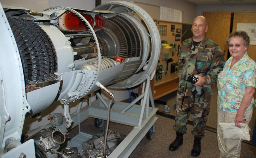 Tech. Sgt. Gerald Sonnenberg is proud of the maintenance folks as he shows off a jet engine training area to his mother who was visiting from Oklahoma for the first time recently.  Photo/Maj. Stan Paregien