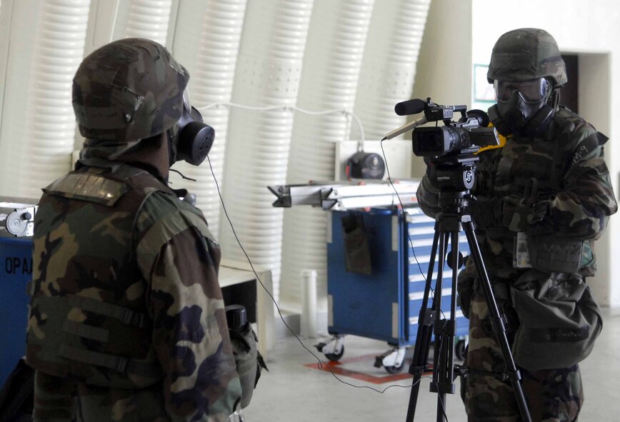 OSAN AIR BASE, Republic of Korea – Staff Sgt. Raymond Winstead, 51st Fighter Wing Public Affairs, conducts an interview with Airman 1st Class Chris Ray, 51st Aircraft Maintenance Squadron, during an exercise here July 22. Airman Ray is an aircraft armament systems specialist. (U.S. Air Force photo/Senior Airman Christopher Boitz)