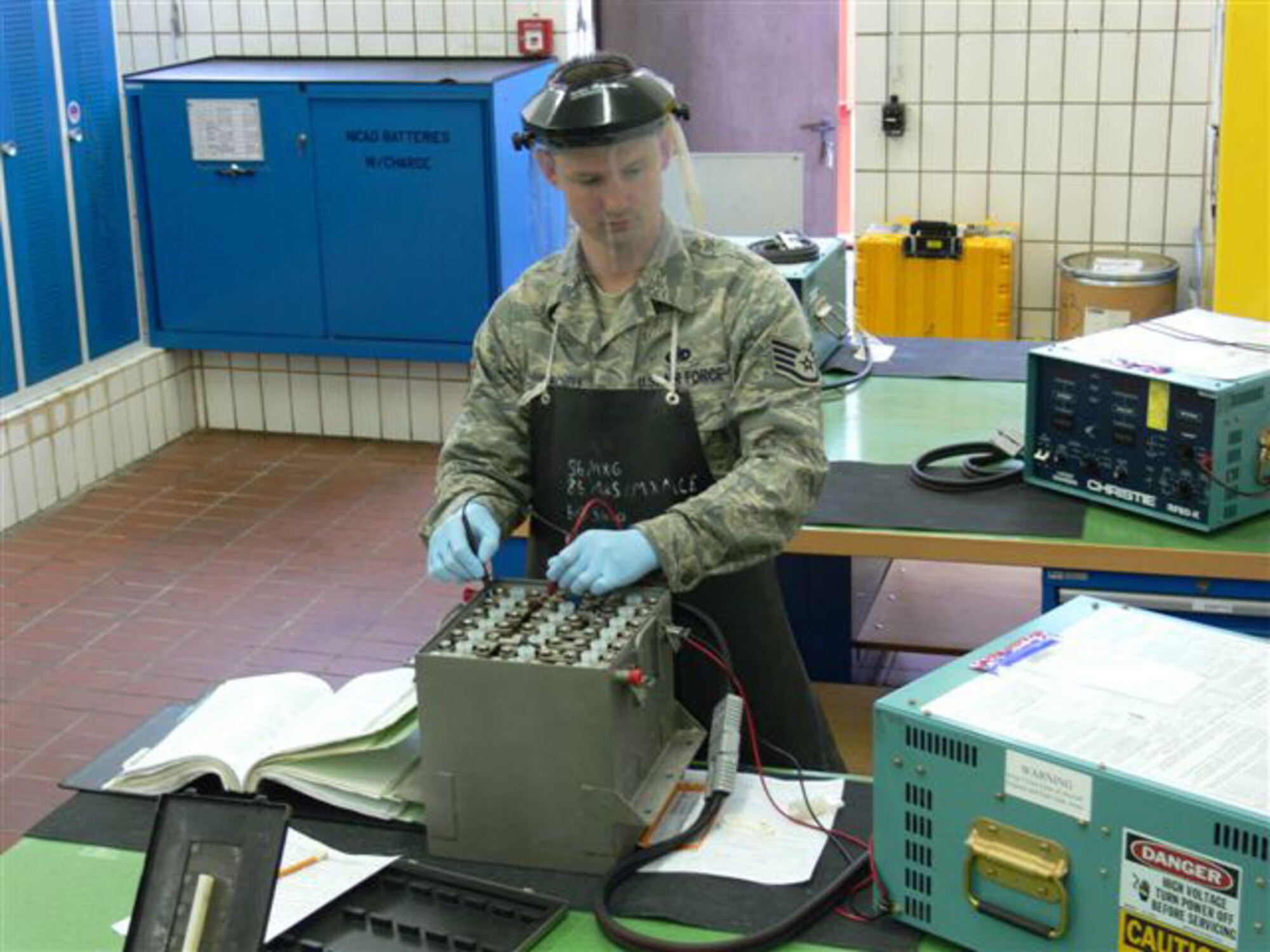 Staff Sgt. Christopher Mitchell, 86th Maintenance Squadron Electrical and Environmental Section, performs an electrical capacitance check on a C-5 lead acid aircraft battery. (Courtesy Photo)