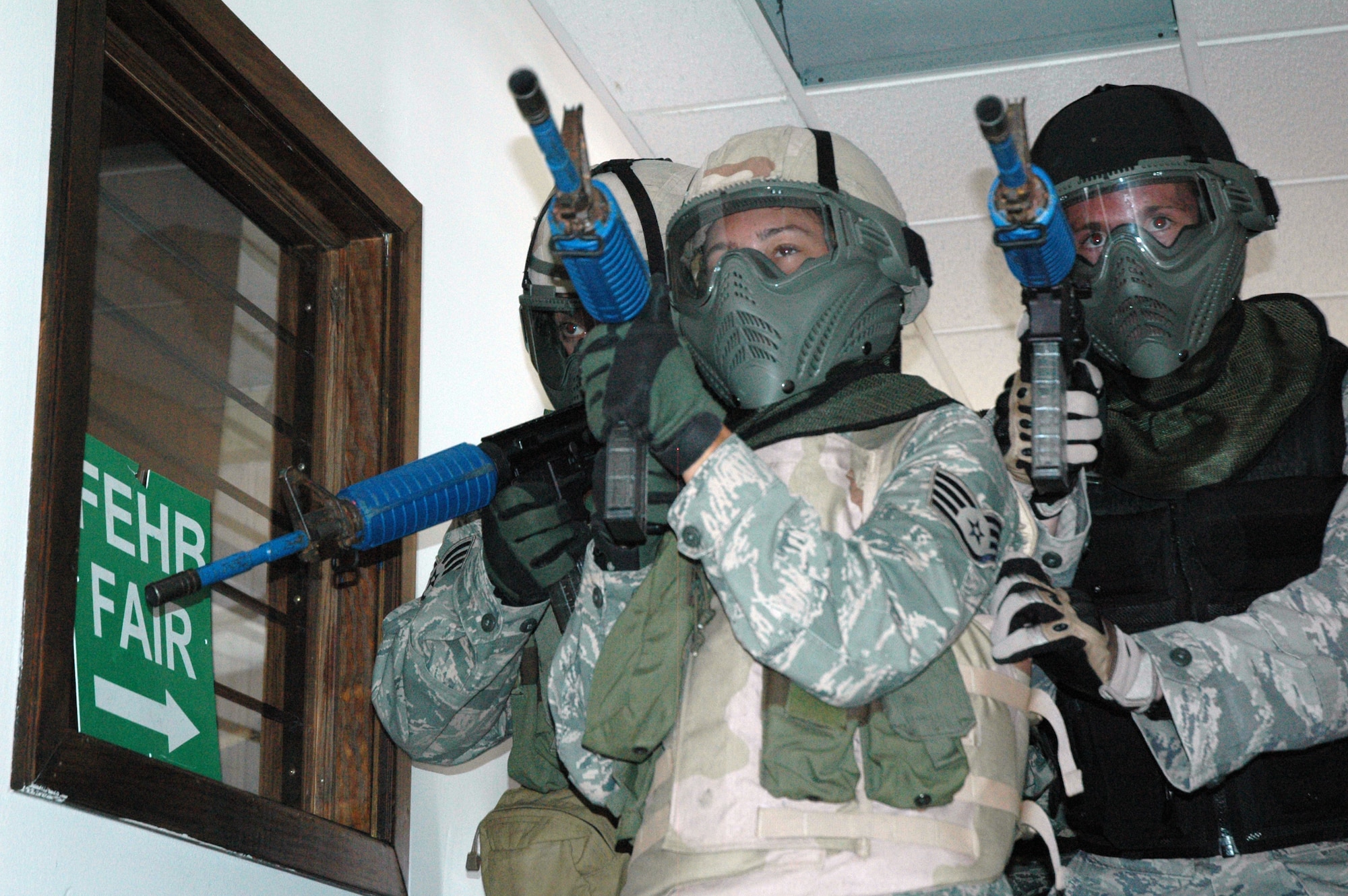 EGLIN AIR FORCE BASE, Fla. -- Security forces Airmen from Eglin and Hurlburt Field perform a scenario from the Active Shooter Instructor Training Course held at Bldg. 591. The training helps military and civilian agencies alike respond to agressive, hostile situations as a joint task force. (U.S. Air Force photo/Staff Sgt. Stacia Zachary)