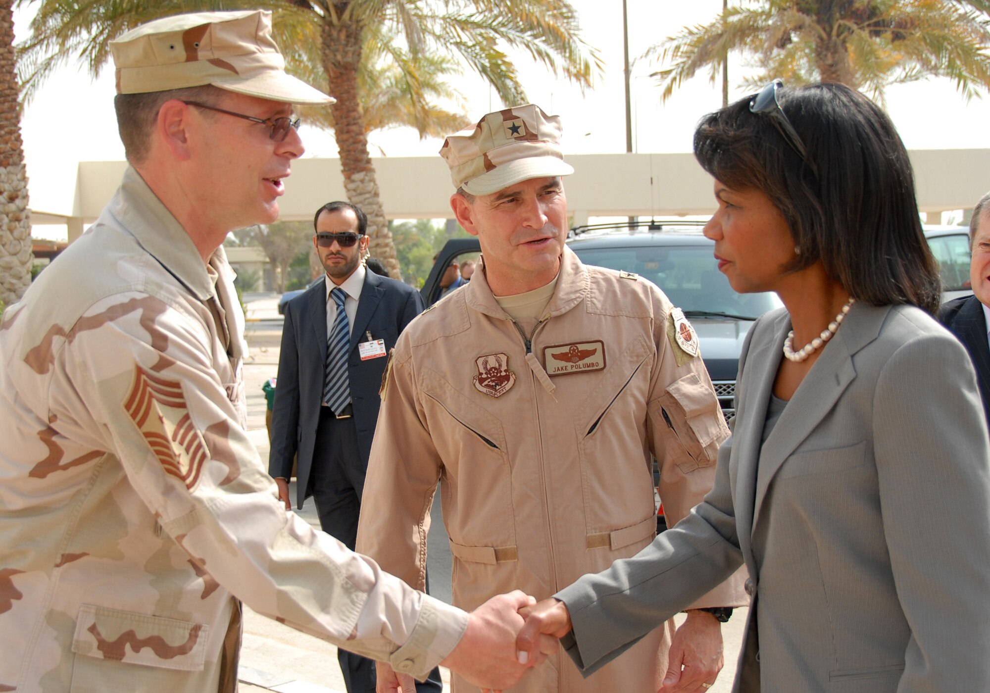 SOUTHWEST ASIA--  Chief Master Sgt. Kevin Slater, 380th Air Expeditionary Wing Command Chief, greets Secretary of State Condoleezza Rice here before she departed enroute to Singapore.
(U.S. Air Force photo/Tech. Sgt. Christopher A Campbell)