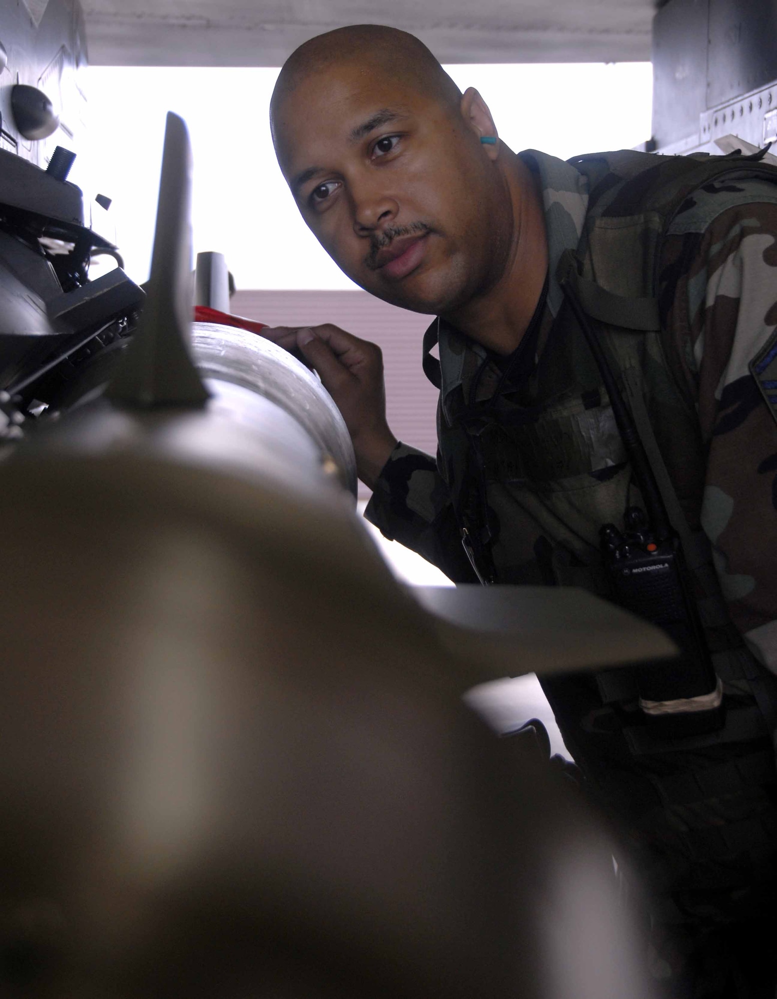 OSAN AIR BASE, Republic of Korea – Master Sgt. Stanley Yarbrough inspects a GBU-12 after it was loaded onto an F-16 aircraft during a base-wide exercise here July 21. The operational readiness exercise tests Team Osan's ability to execute combat operations, receive follow-on forces and defend the base from attack. Sergeant Yarbrough is the 51st Aircraft Maintenance Squadron’s weapons NCOIC. (U.S. Air Force photo/Senior Airman Christopher Boitz)