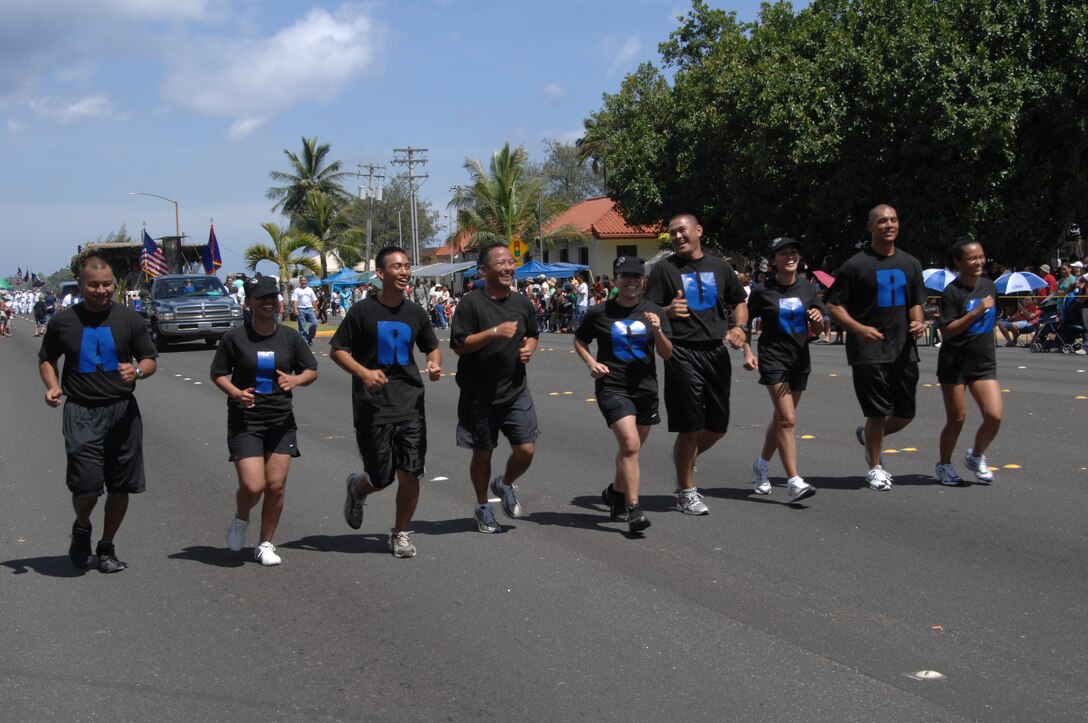 U.S. Air Force Air National Guardsmen run together during the 64th Annual Guam Liberation Day Parade July 21. The theme for this year’s parade was Inafa'maolek: Inaguaiya Yan Kinenprende Para Tudu (Sharing: Love and Understanding for All). (U.S. Air Force photo by Airman 1st Class Courtney Witt)