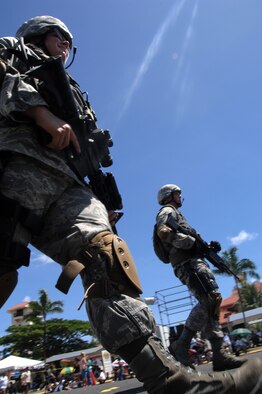 Members of the 36th Security Forces Squadron represent Andersen during the 64th Annual Guam Liberation Day Parade July 21. The theme for this yea’rs parade was Inafa'maolek: Inaguaiya Yan Kinenprende Para Tudu (Sharing: Love and Understanding for All). (U.S. Air Force photo by Airman 1st Class Courtney Witt)