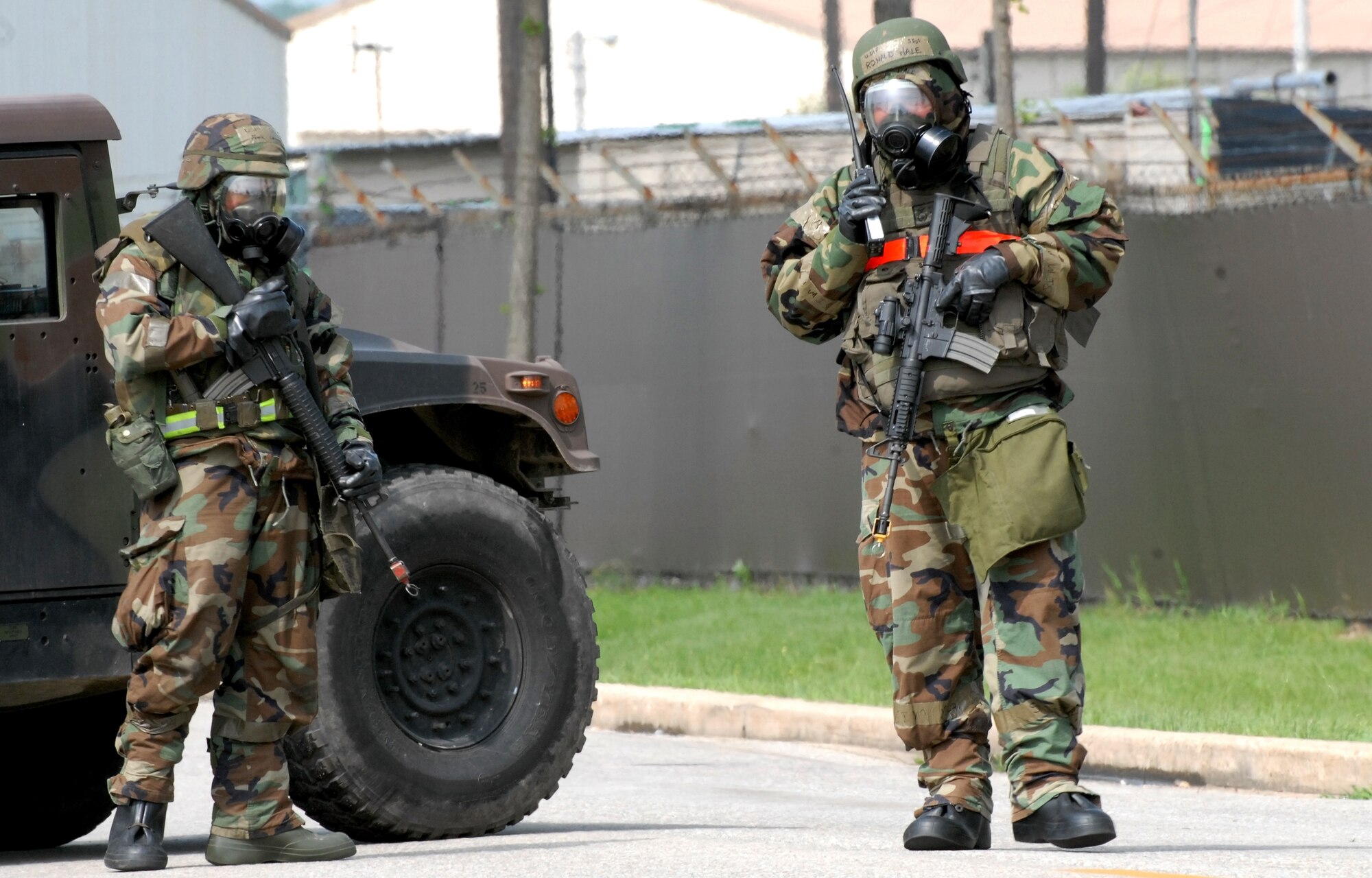 KUNSAN AIR BASE, Republic of Korea -- Members of the 8th Security Forces Squadron stand guard at an intersection during a bomb threat here July 22.  The bomb threat is a part of the peninsula wide operational readiness exercise being conducted here to evaluate the wing’s readiness and ability to perform its wartime mission.  (U.S. Air Force photo/TSgt Quinton T. Burris)