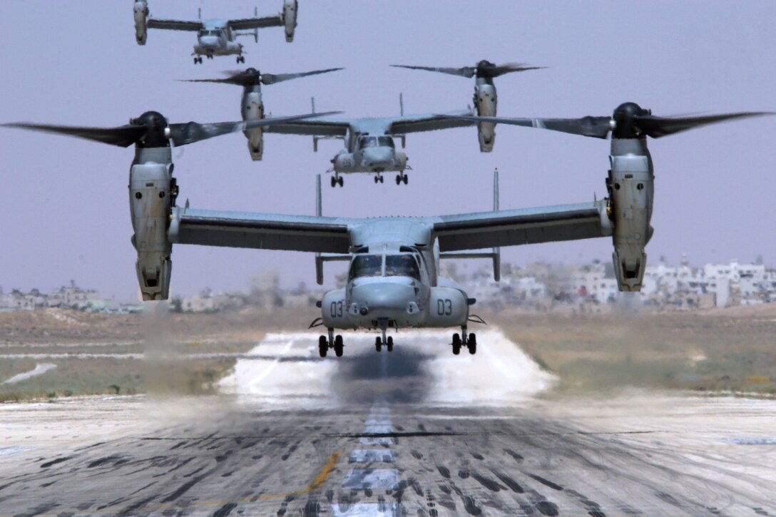 Three MV-22 Ospreys with Marine Medium Tiltrotor Squadron 162, Marine Aircraft Group 16, 3rd Marine Aircraft Wing (Forward), land at an airport in Amman, Jordan on July 22. Four aircraft from the squadron transported Sens. Barack Obama (D-Ill.), Jack Reed (D-R.I.) and Chuck Hagel (R-Neb.) from Iraq's al-Anbar Province to Jordan on July 22.