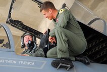 Television host Ian Wright and Capt. Dave Magnuson, an F-15 pilot with the 67th Fighter Squadron, discuss flying operations during Mr. Wright's visit to Kadena Air Base July 21-22 for his new series called "Ian Wright: Out of Bounds". While at Kadena, Mr. Wright toured various 18th Wing units, interacted with Airmen and took part in some "hands-on" activities designed to highlight the diverse roles and missions of the largest U.S. air base in the Pacific. The episode will air on the Travel Channel and Discovery Channel Asia in October 2008.  (U.S. Air Force photo/Amn Jajuan Perry)