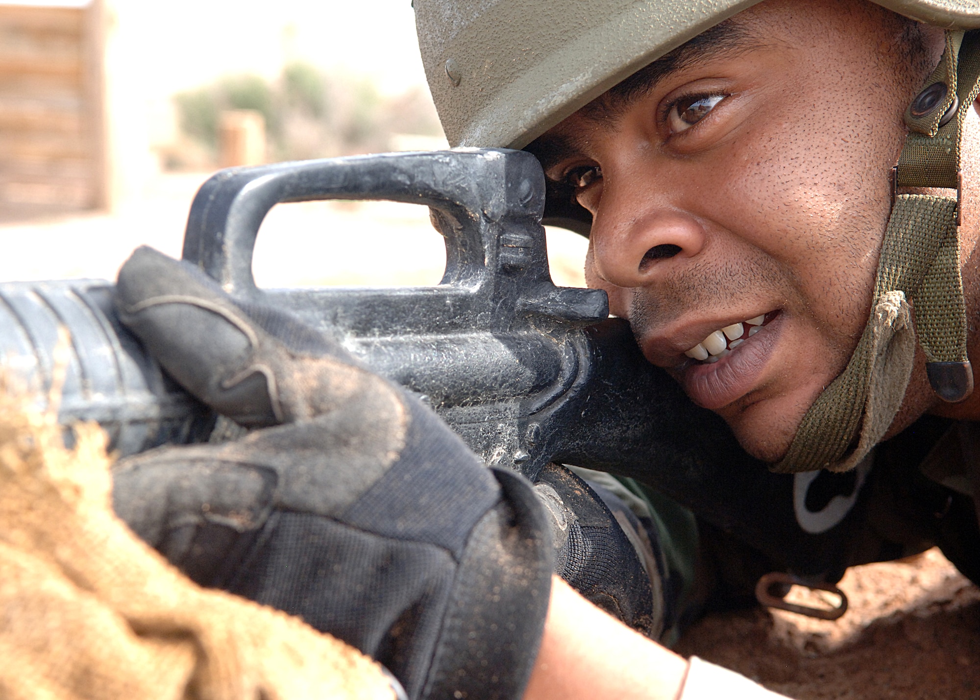 Senior Airman David McCall, 49th Materiel Maintenance Squadron, keeps his sights down range during a training exercise at the Combat Skills Training Course at Holloman Air Force Base, N.M., July 22.  The Combat Skills Training Course is a 19 hour course that consists of pre-deployment training and combat tactical skills training.  (U.S. Air Force photo/Airman 1st Class John Strong)