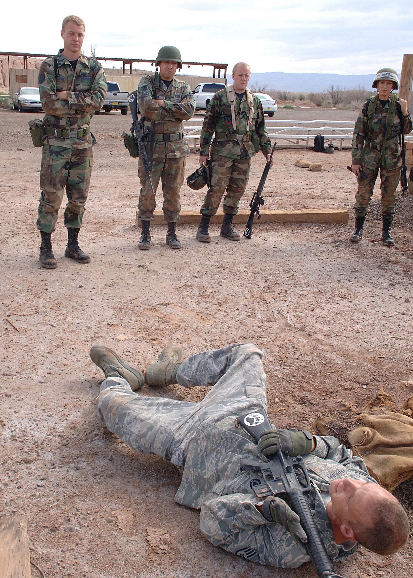 Staff Sgt. Jason Broadaway, 49th Security Forces Squadron, demonstrates a back crawl to his class during the Combat Skills Training Course, at Holloman Air Force Base, N.M., July 22.  The Combat Skills Training Course is a 19 hour course that consists of pre-deployment training and combat tactical skills training.  (U.S. Air Force photo/Airman 1st Class John Strong)
