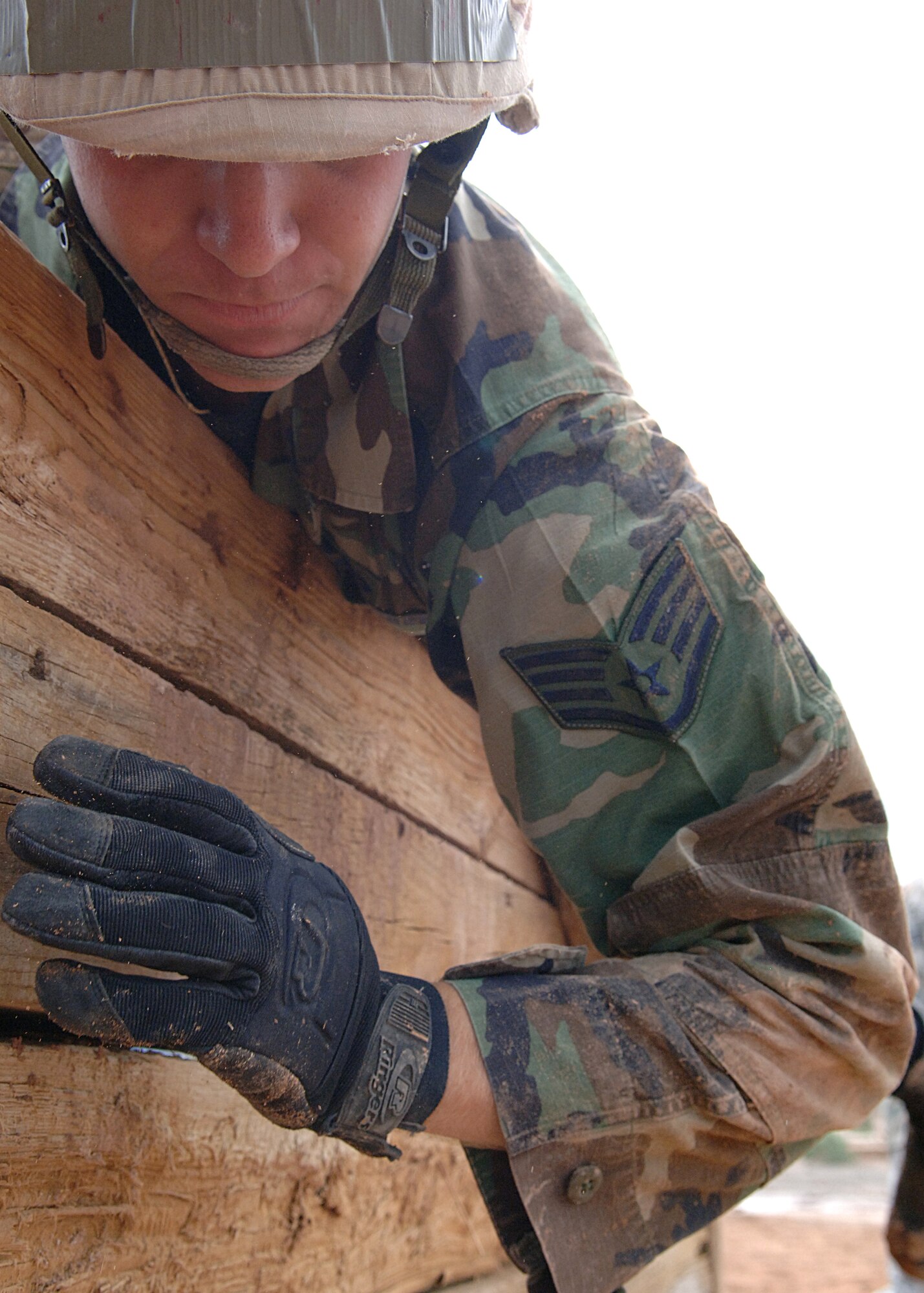 Staff Sgt. Travis Benne, 49th Civil Engineering Squadron, hops over a wall during an exercise at the Combat Skills Training Course at Holloman Air Force Base, N.M., July 22.  The Combat Skills Training Course is a 19 hour course that consists of pre-deployment training and combat tactical skills training.  (U.S. Air Force photo/Airman 1st Class John Strong)