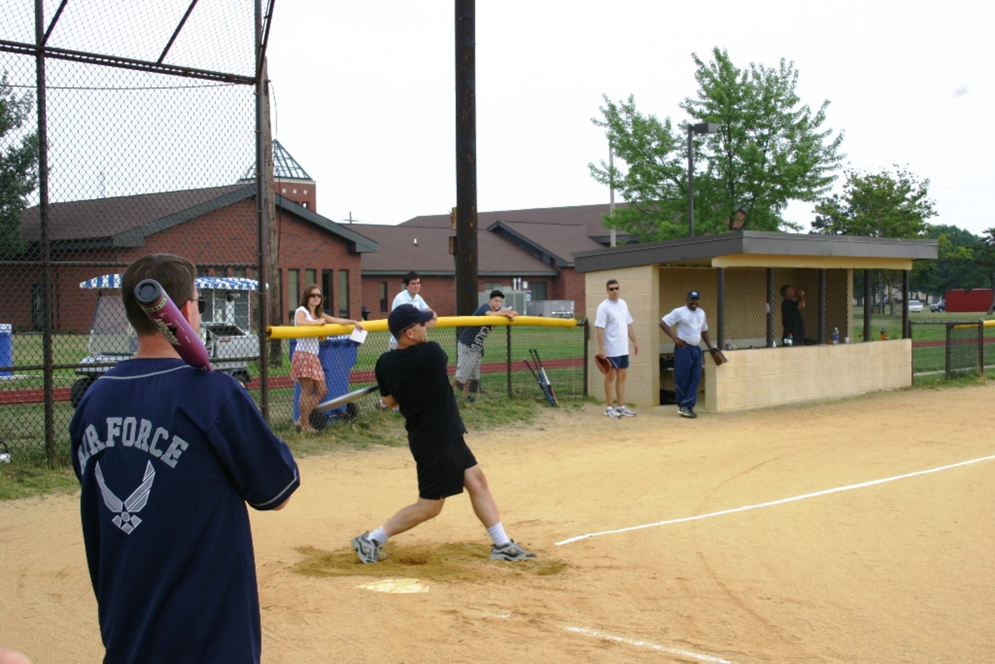 With a perfect swing and perfect hip-rotation, Colonel Steven Bernard, 621st Contingency Response Wing commander crushed a ball to center field during the Chief's vs. Eagles softball game on 22 July. The game was close thoughout, but the chief's were able to hang on to a one point lead, winning the game 14-13.