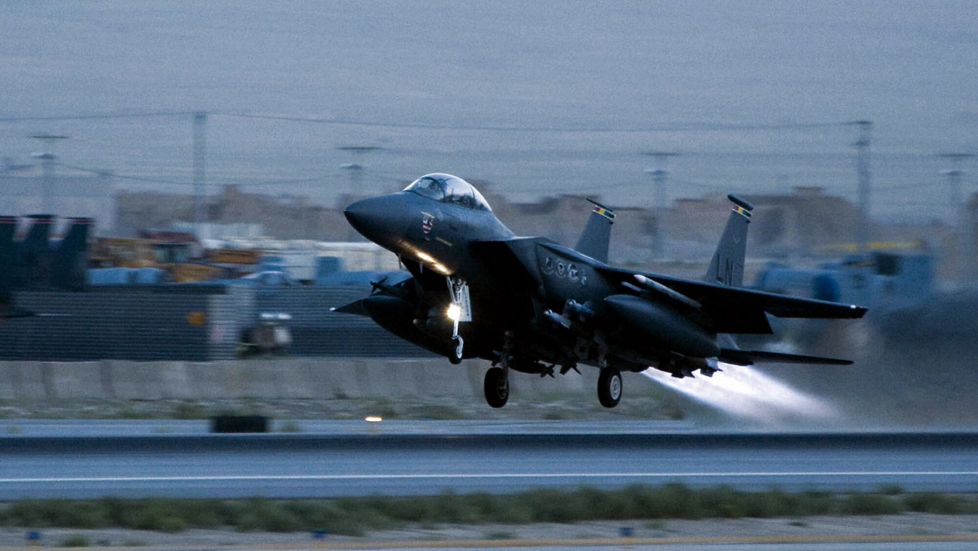 An F-15E Strike Eagle takes off from Bagram Air Base supporting Operation Enduring Freedom. The F-15E is a dual-role fighter designed to perform air-to-air and air-to-ground missions. An array of avionics and electronics systems gives the F-15E the capability to fight at low altitude, day or night, and in all weather. (U.S. Air Force photo/Staff Sgt. Samuel Morse)  

