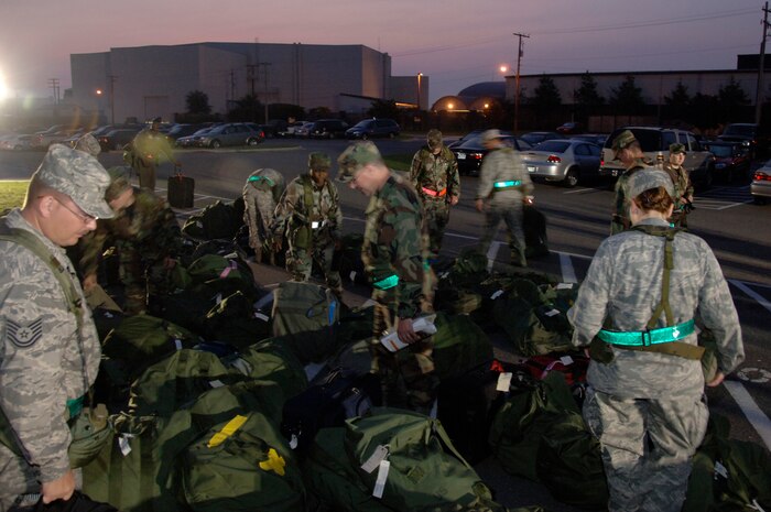Team Charleston Airmen prepare to "deploy" during the operational readiness exercise July 22. A total of eight chalks were processed as part of Charleston's series of exercises to perfect its ability to respond to peacetime and wartime missions. (U.S. Air Force photo/Airman 1st Class Timothy Taylor)