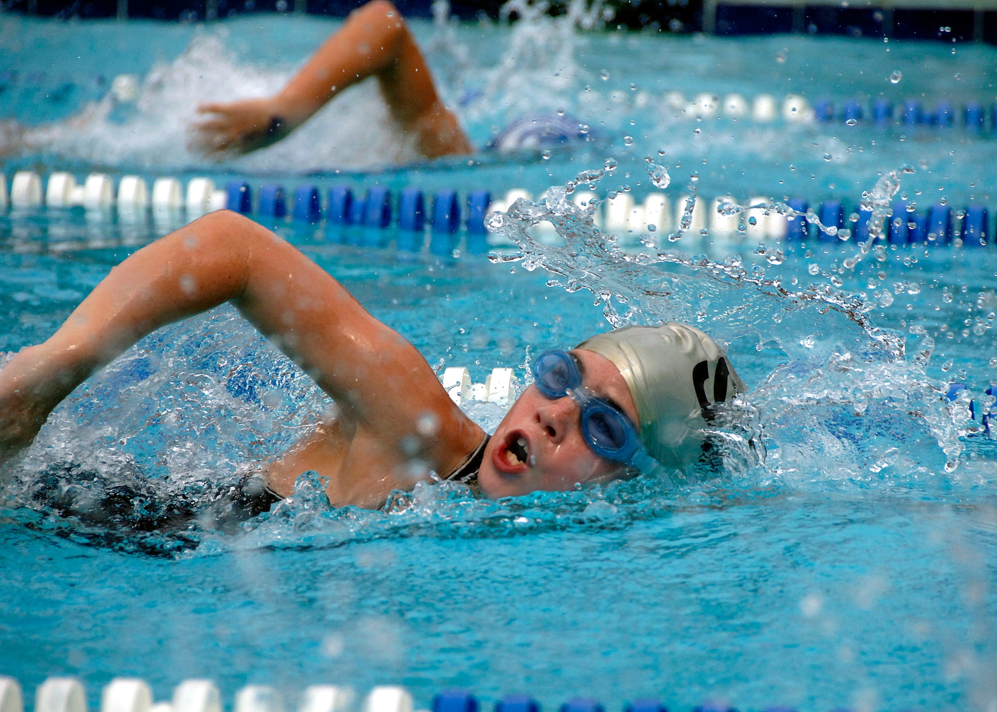 A child from the 2008 Coastal Carolina Aquatics Association swimming championship competes in the girls 50-meter freestyle event at the Jewish Community Center, Charleston, S.C., July 20. More than 100 children participated in the meet, to include Charleston AFB youths who were part of the Federal Armed Services Team. (U.S. Air Force photo/Airman 1st Class Timothy Taylor)