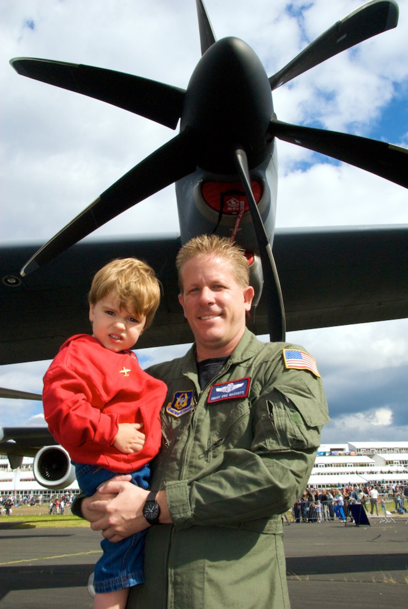 Senior Master Sgt. Eric Gassiott of the 815th Airlift Squadron gives Samuel Stevens of Hungary a tour of a Flying Jennies C-130J. Samuel, wearing a C-130J pin on his jacket, loved learning about aviation. "This is why we do air shows," said Maj. Chad Gibson, chief of public affairs for the 403rd Wing. "The dreams of kids are created here." In July, Sergeant Gassiott, Major Gibson and other reservists from Keesler Air Force Base, Miss., showcased the transport aircraft at the Farnborough Air Show in England, the largest air show in the world with more than a quarter of a million visitors. (U.S. Air Force photo/Maj. Chad Gibson)