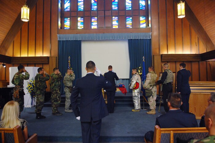 NELLIS AIR FORCE BASE, Nev. -- Members of the 99th Civil Engineer Squadron render the Final Slaute to 1st Lt. Dominic Romano's Memmorial Service July 22, 2008 at Base Chapel, here. Lieutenant Romano died July 18 from injuries sustained in a June motorcycle accident. (U.S. Air Force photo by Senior Airman Jason R. Huddleston)